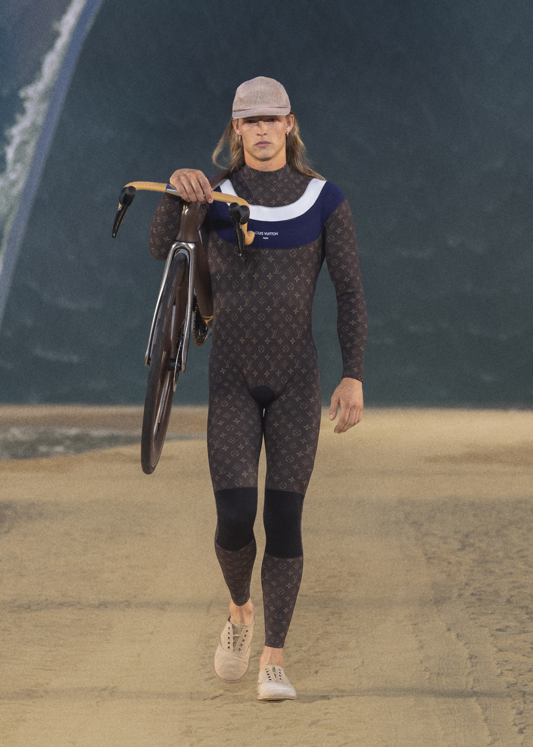 Man carrying Pinarello x Louis Vuitton Dogma F at Paris Fashion Week.