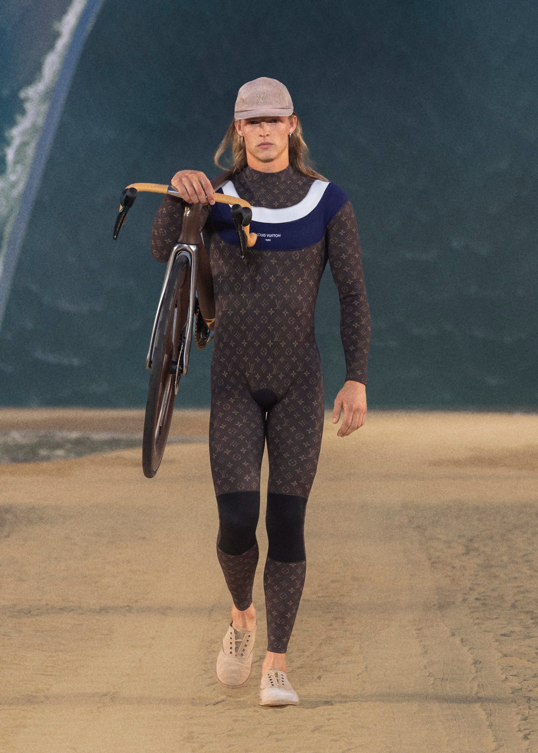 Man carrying Pinarello x Louis Vuitton Dogma F at Paris Fashion Week.