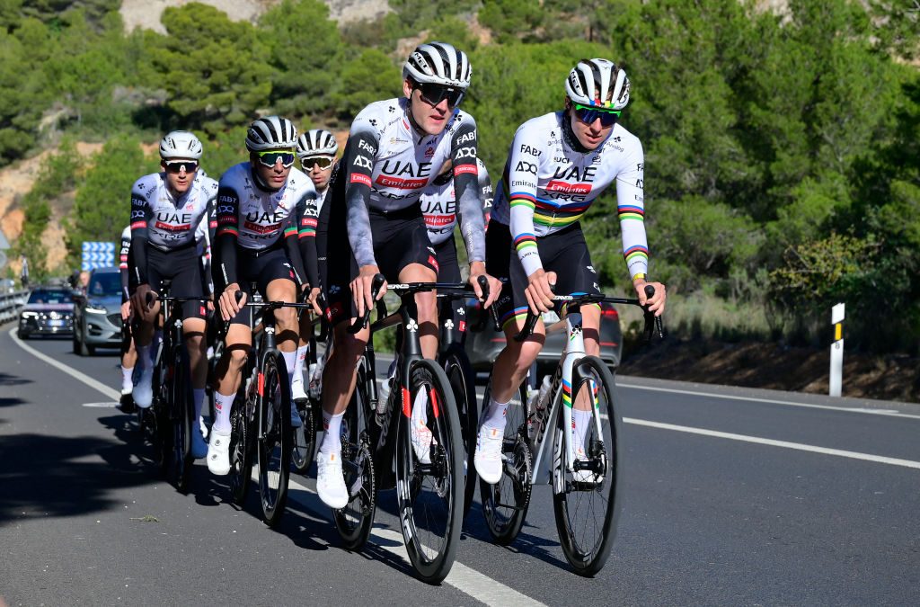 UAE team's Sloveinian cyclist Tadej Pogacar (R) rides with teammates during a training session in Benidorm ,on December 10, 2024. (Photo by JOSE JORDAN / AFP) (Photo by JOSE JORDAN/AFP via Getty Images)