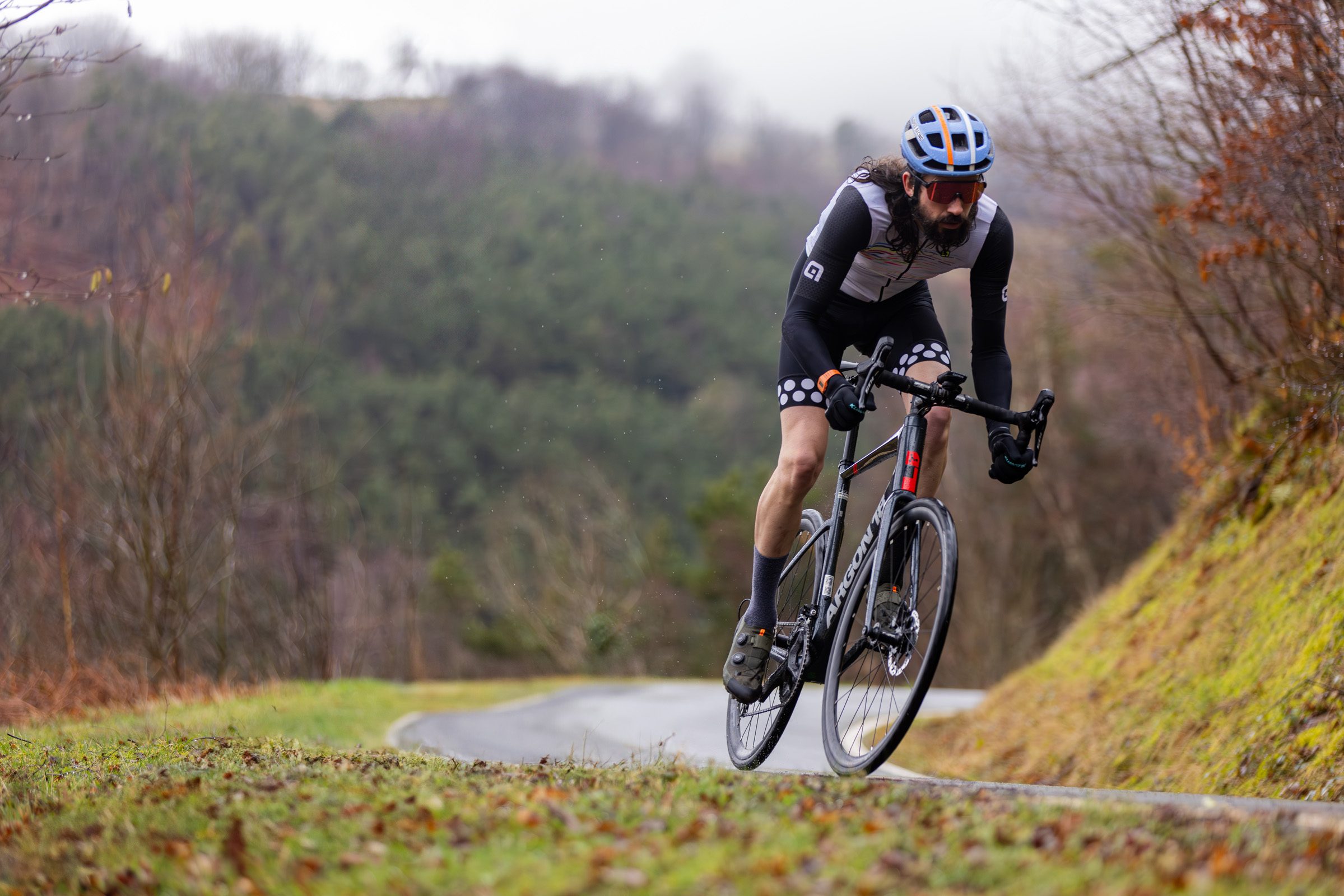 Male rider in grey top riding the Argon 18 Equation 105 road bike