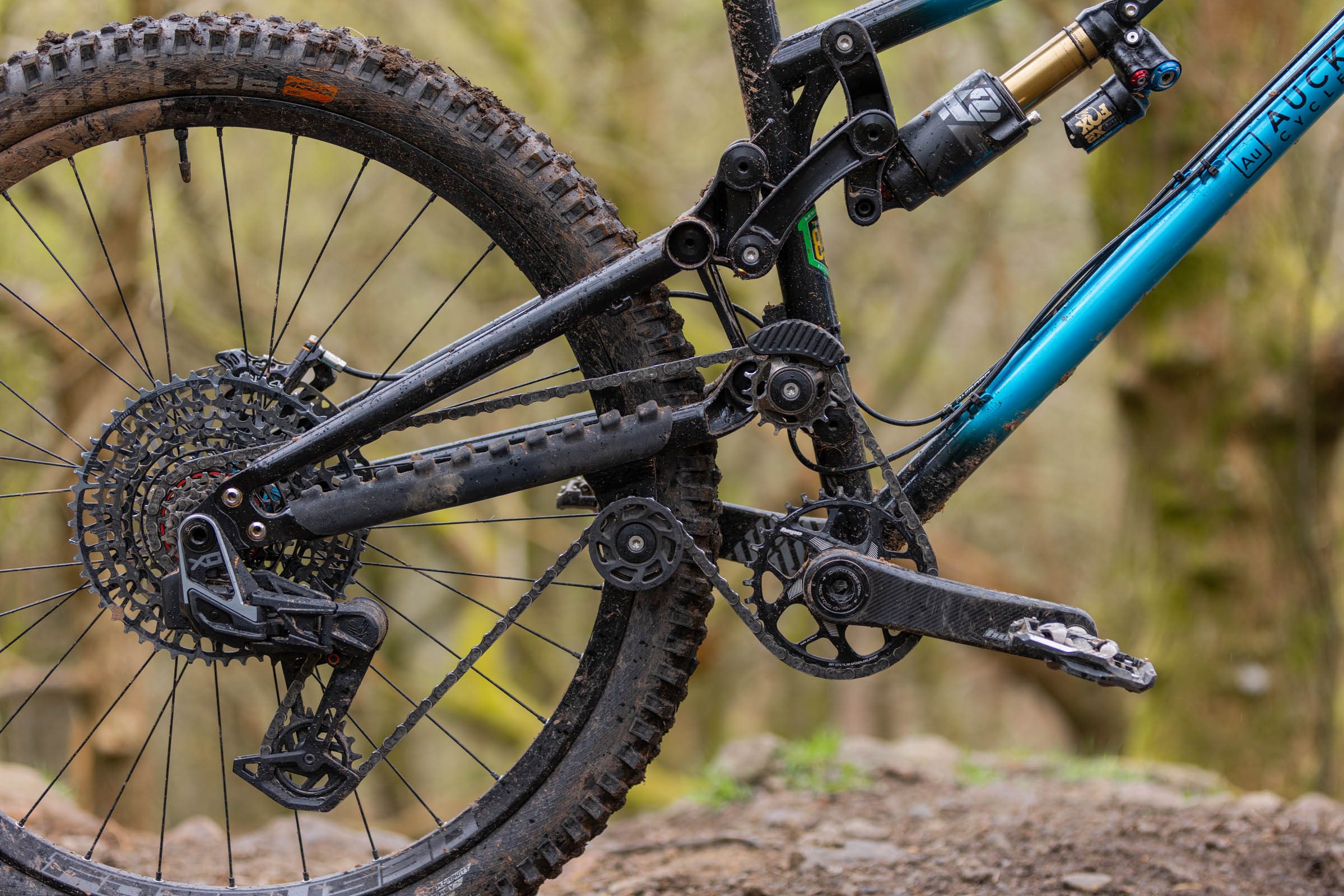 Close-up of the Auckland Cycle Works Marra rear suspension linkage, shock, drivetrain and idler pulley system