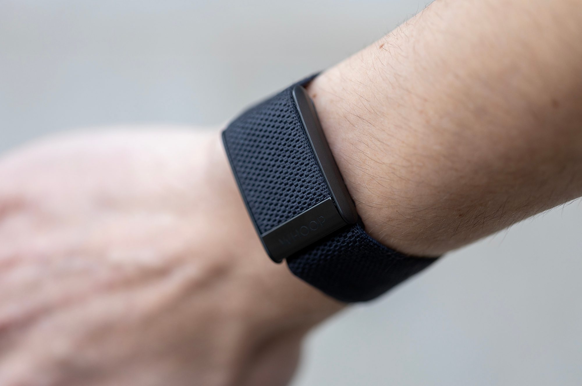 Whoop 4.0 Band on wrist.