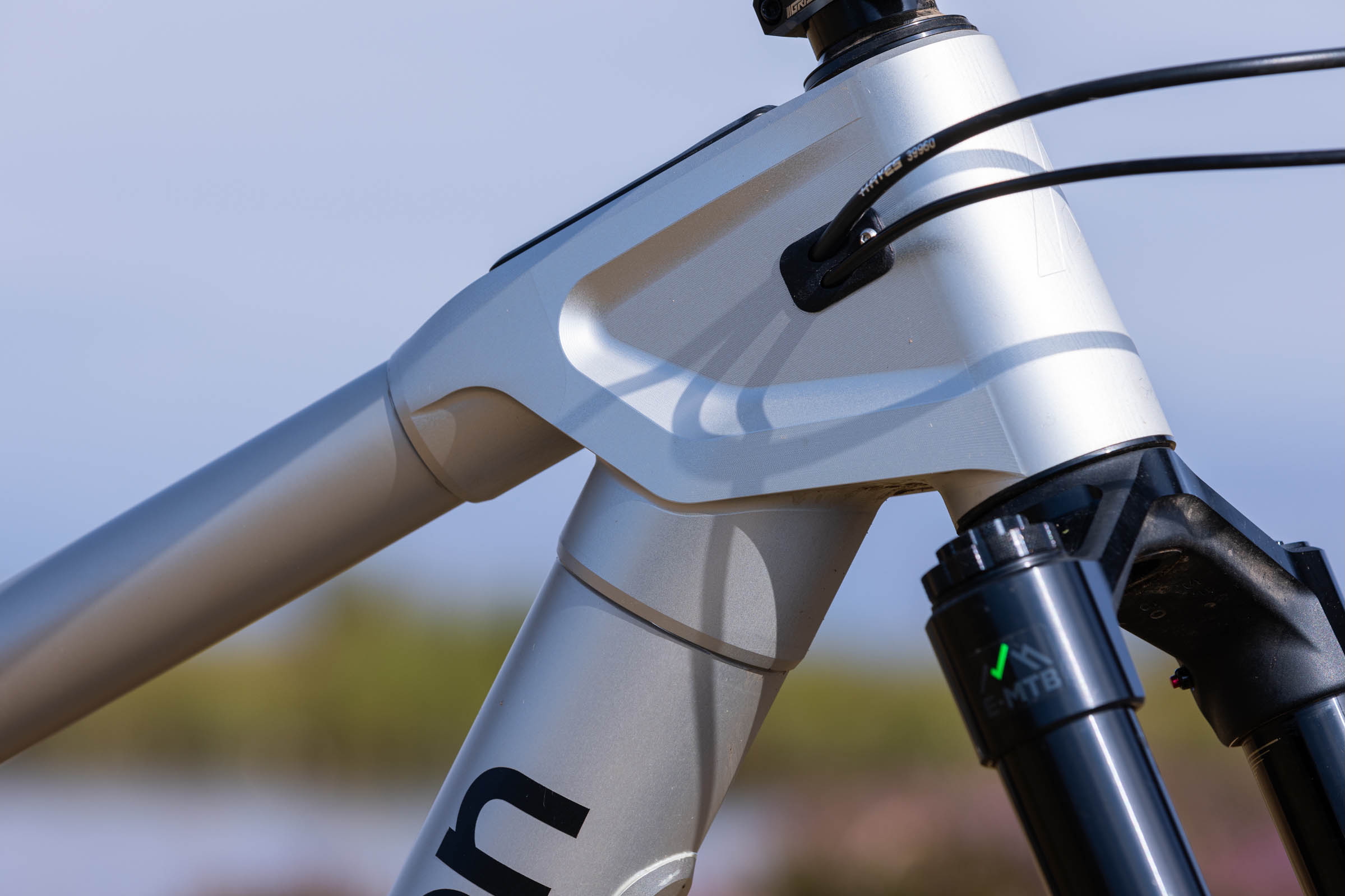 Close-up of the Atherton S.170E.2’s machined aluminium head-tube lug and bonded frame tubes