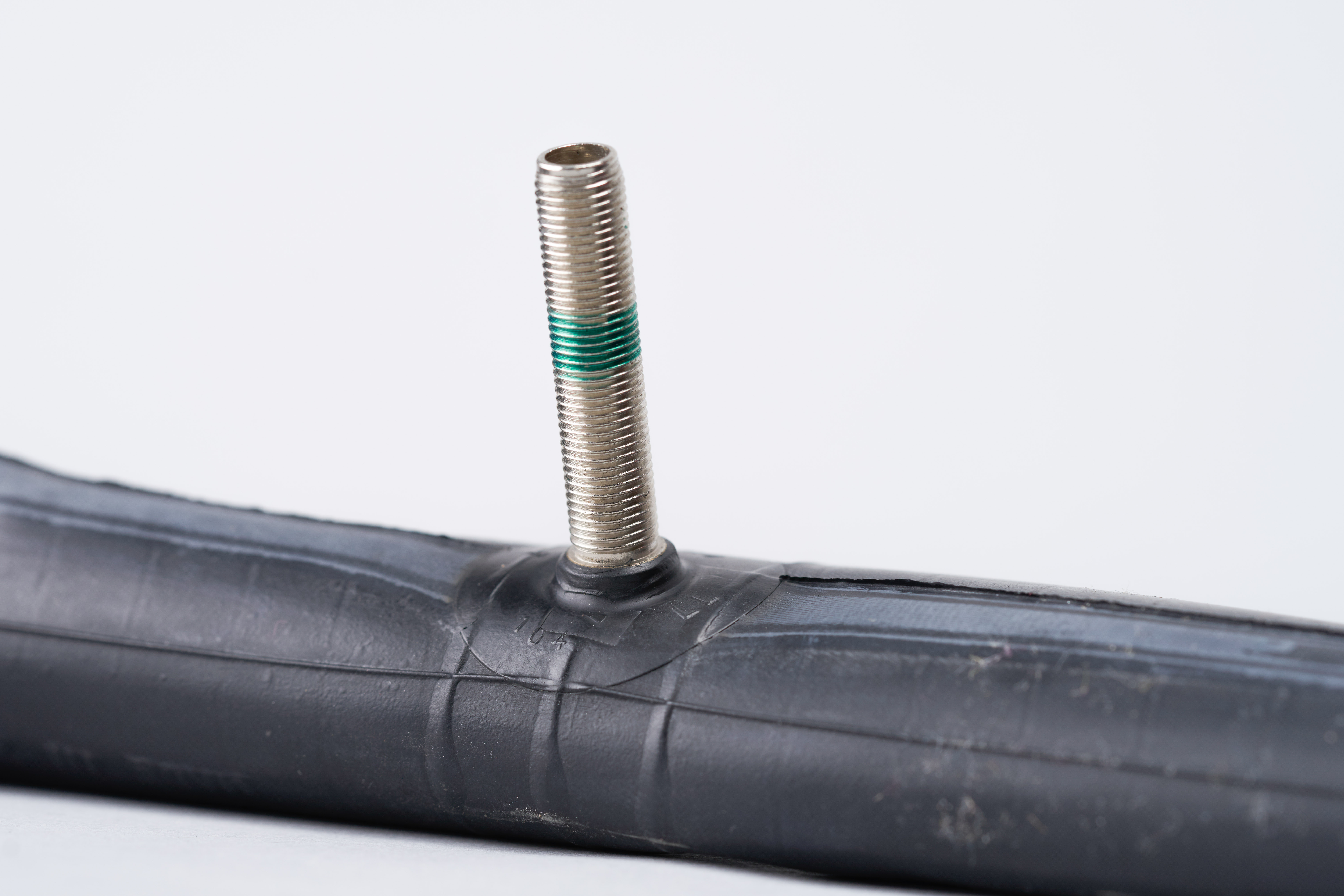 Schrader valve Schrader valve against a white background