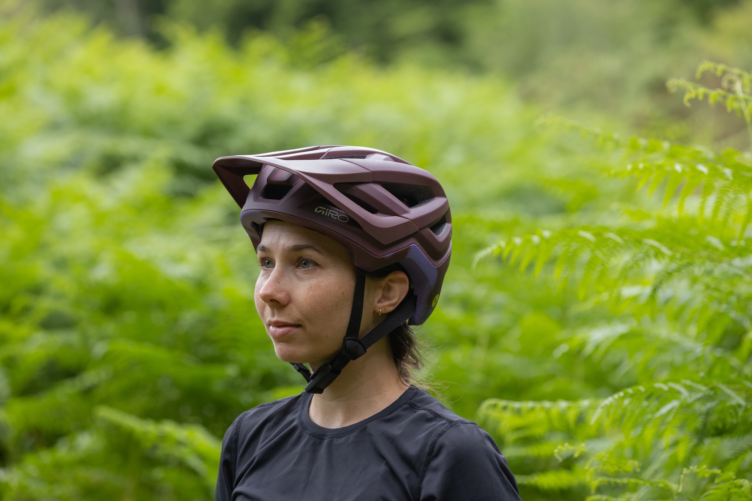 Rider wearing the Giro Montaro Mips III trail mountain bike helmet in woodland.