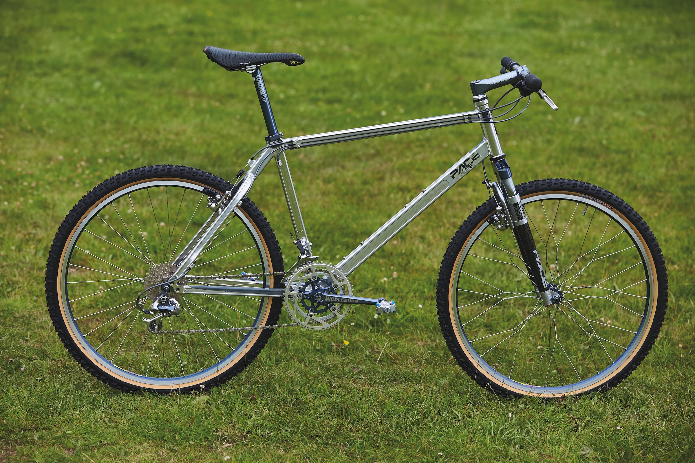 Polished Pace RC200 hardtail mountain bike with square-section aluminium tubing and Pace suspension fork.