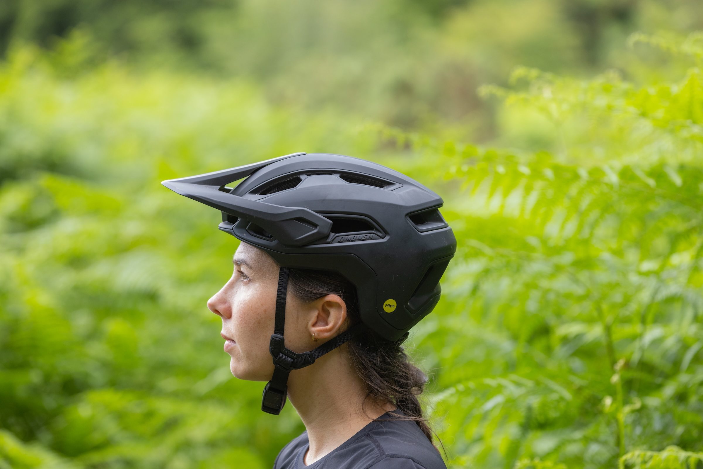 Side profile of a rider wearing the Specialized Ambush 3.