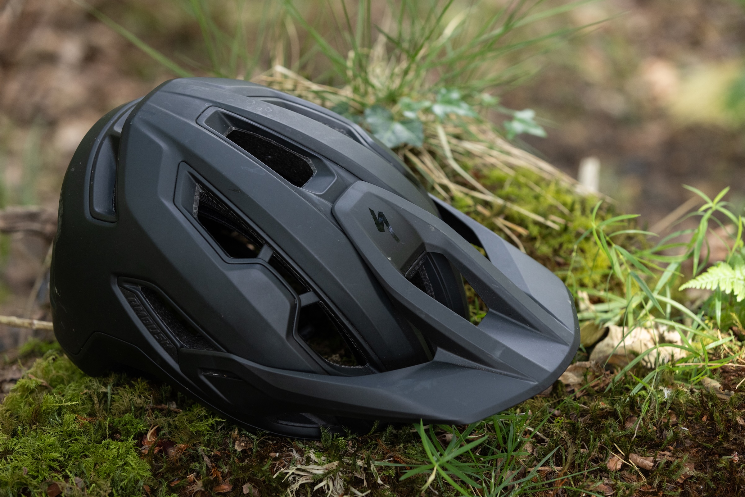 Close-up of the front quarter of the Specialized Ambush 3 mountain bike helmet.