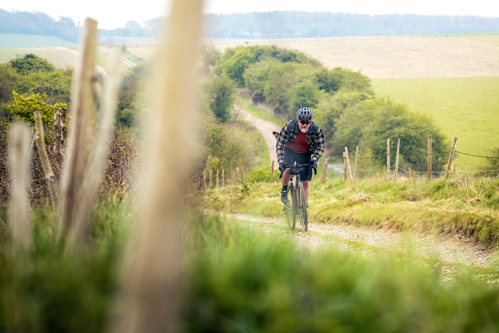 Male cyclist riding the Cervélo Áspero-5 Force eTap AXS 1 gravel bike