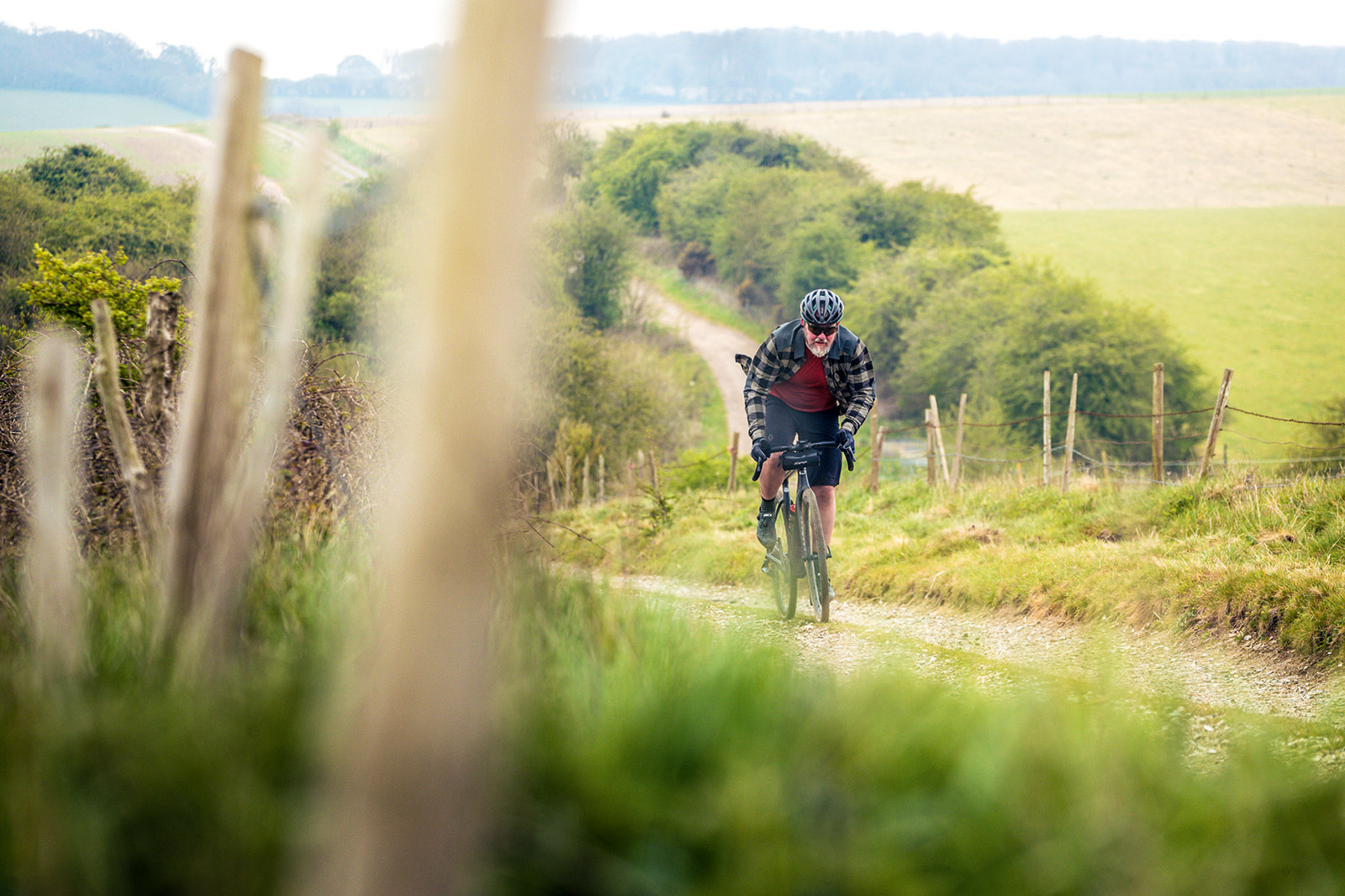 Male cyclist riding the Cervélo Áspero-5 Force eTap AXS 1 gravel bike