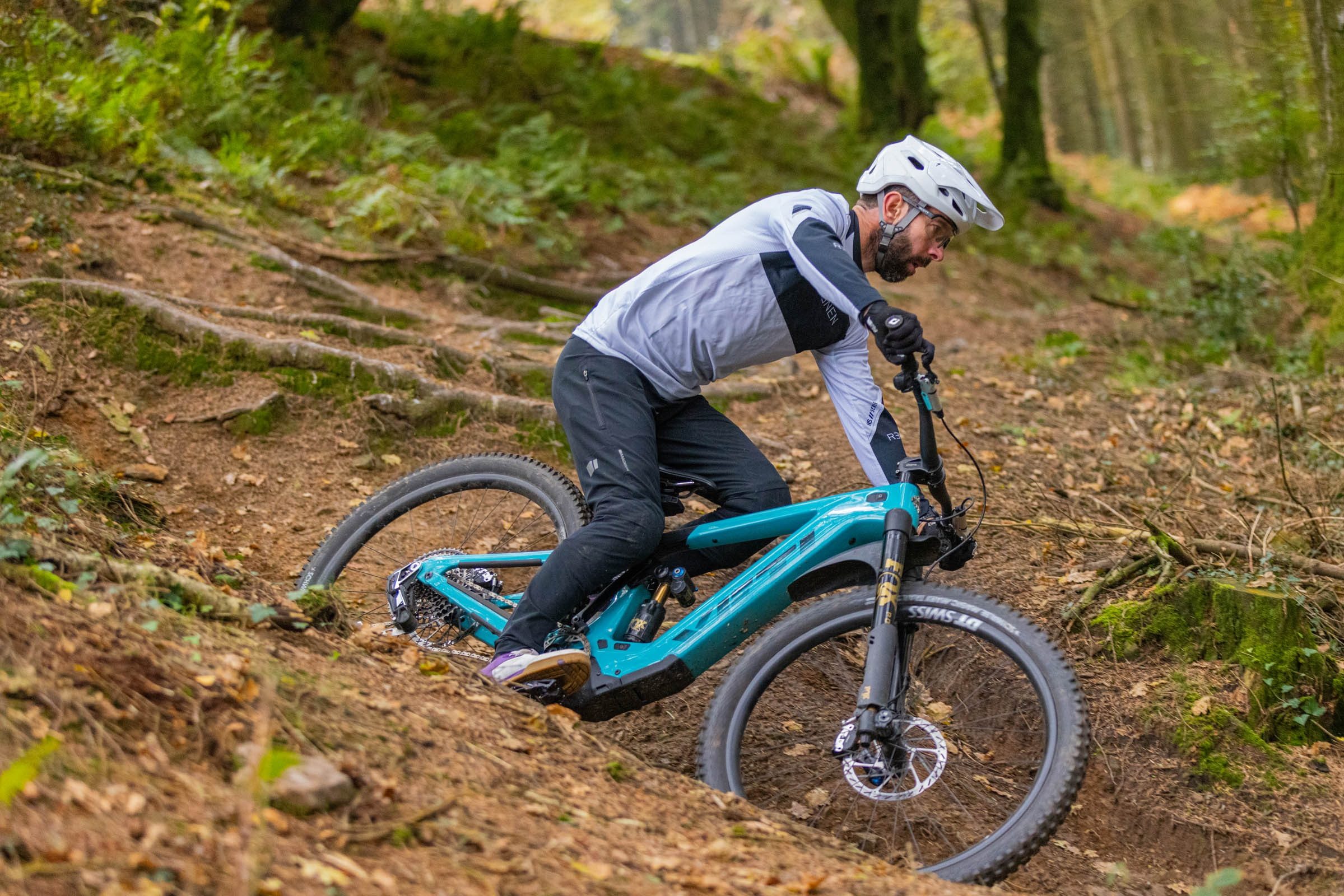 Rob Weaver on the Yeti LTE T4 eMTB riding around a wooded corner