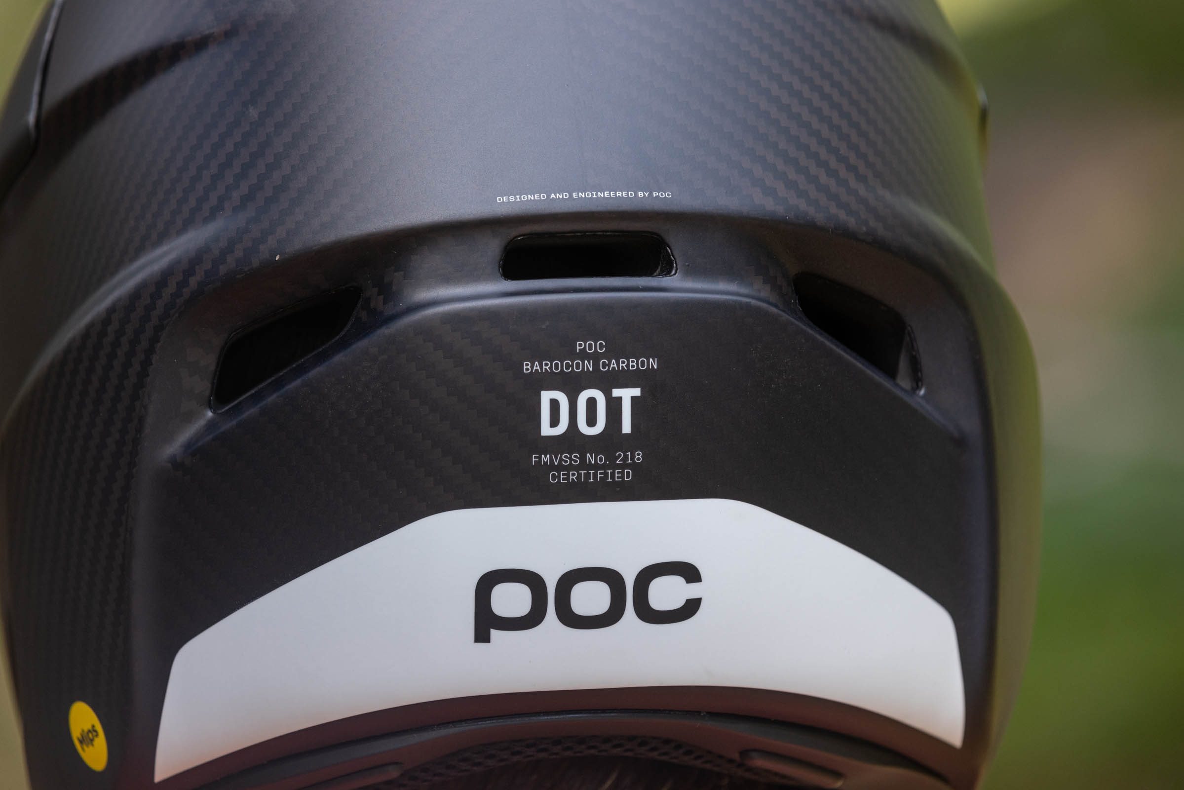 Cropped shot showing the POC Barocon Carbon full-face helmet's safety credentials.