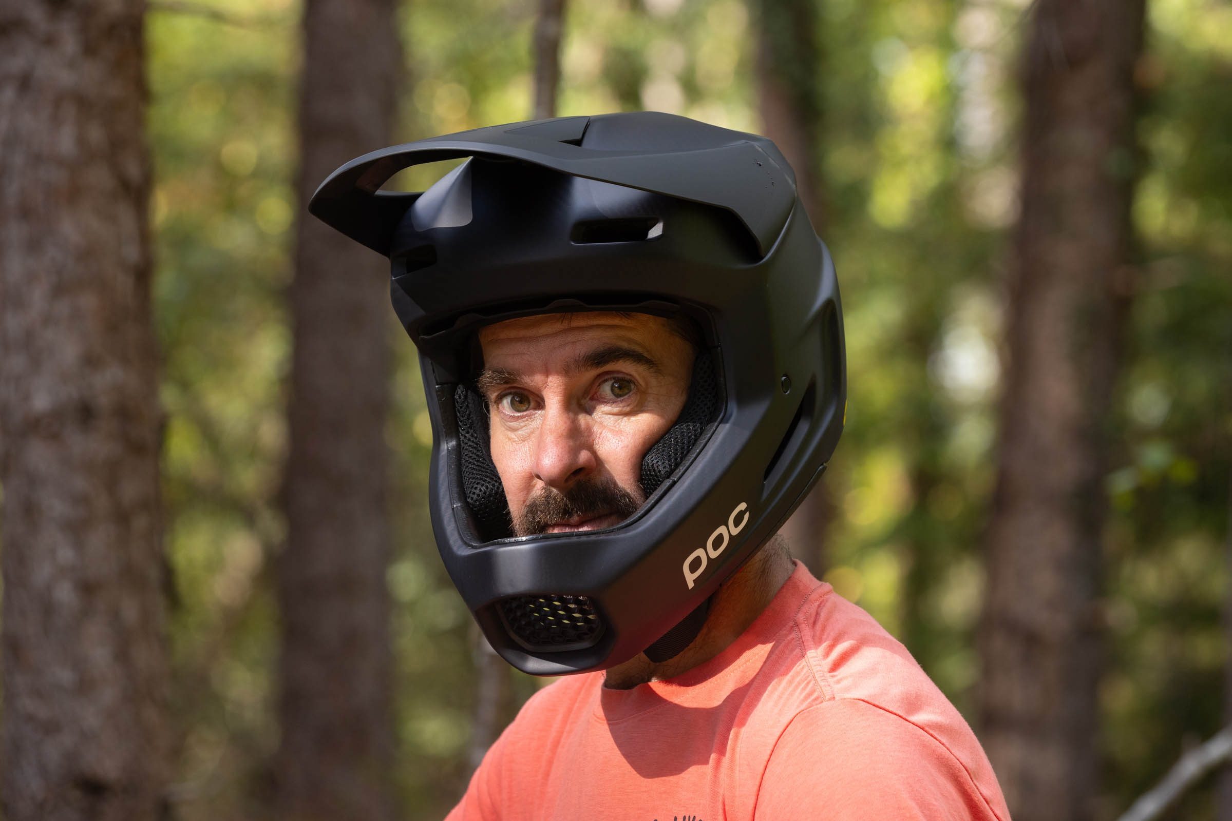 Rider looking directly at the camera wearing the POC Barocon Carbon full-face helmet.