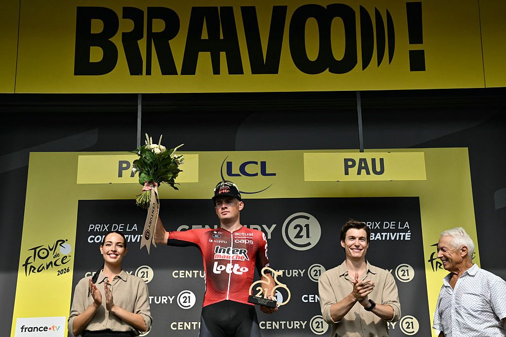 Lotto Intermarché team's French rider Baptiste Veistroffer celebrates on the podium with the most combative rider award after the 5th stage of the 113th edition of the Tour de France cycling race, 158 km between Lannemezan and Pau in southwestern France, on July 8, 2026. (Photo by Jeff PACHOUD / AFP via Getty Images)