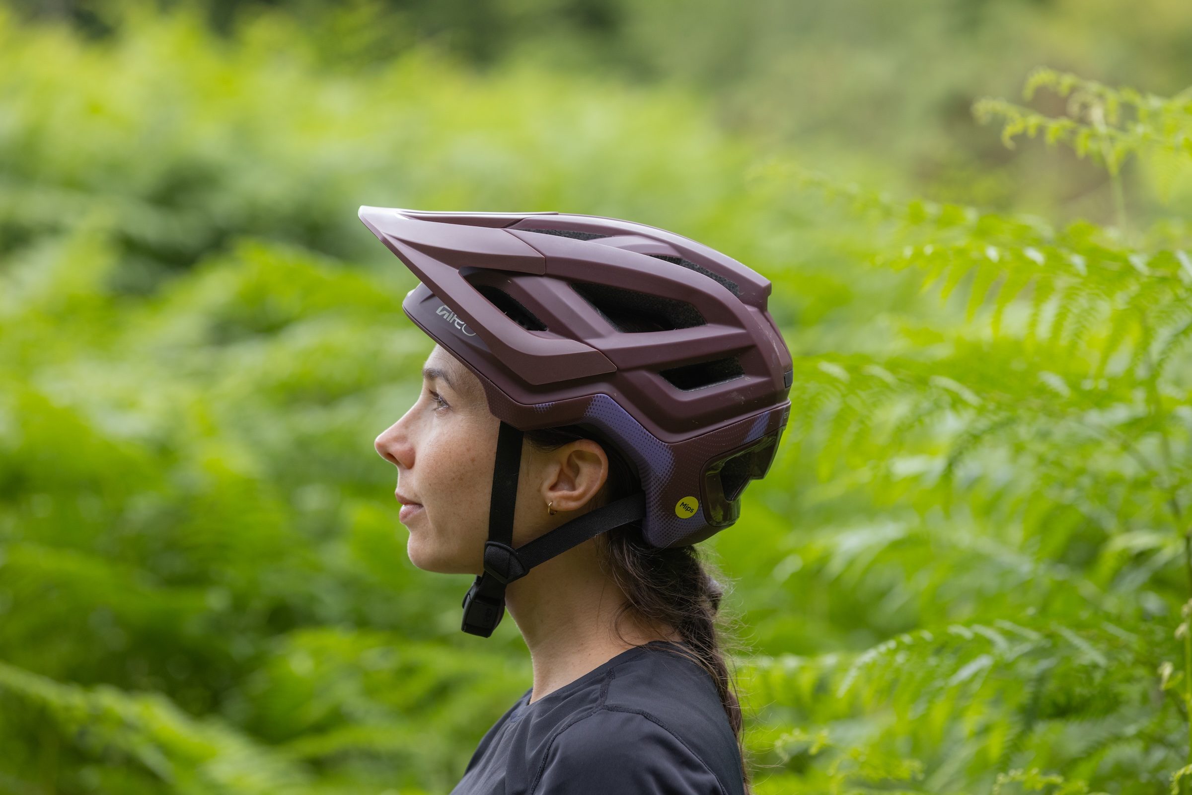 Side profile of a rider wearing the Giro Montaro Mips III trail mountain bike helmet.