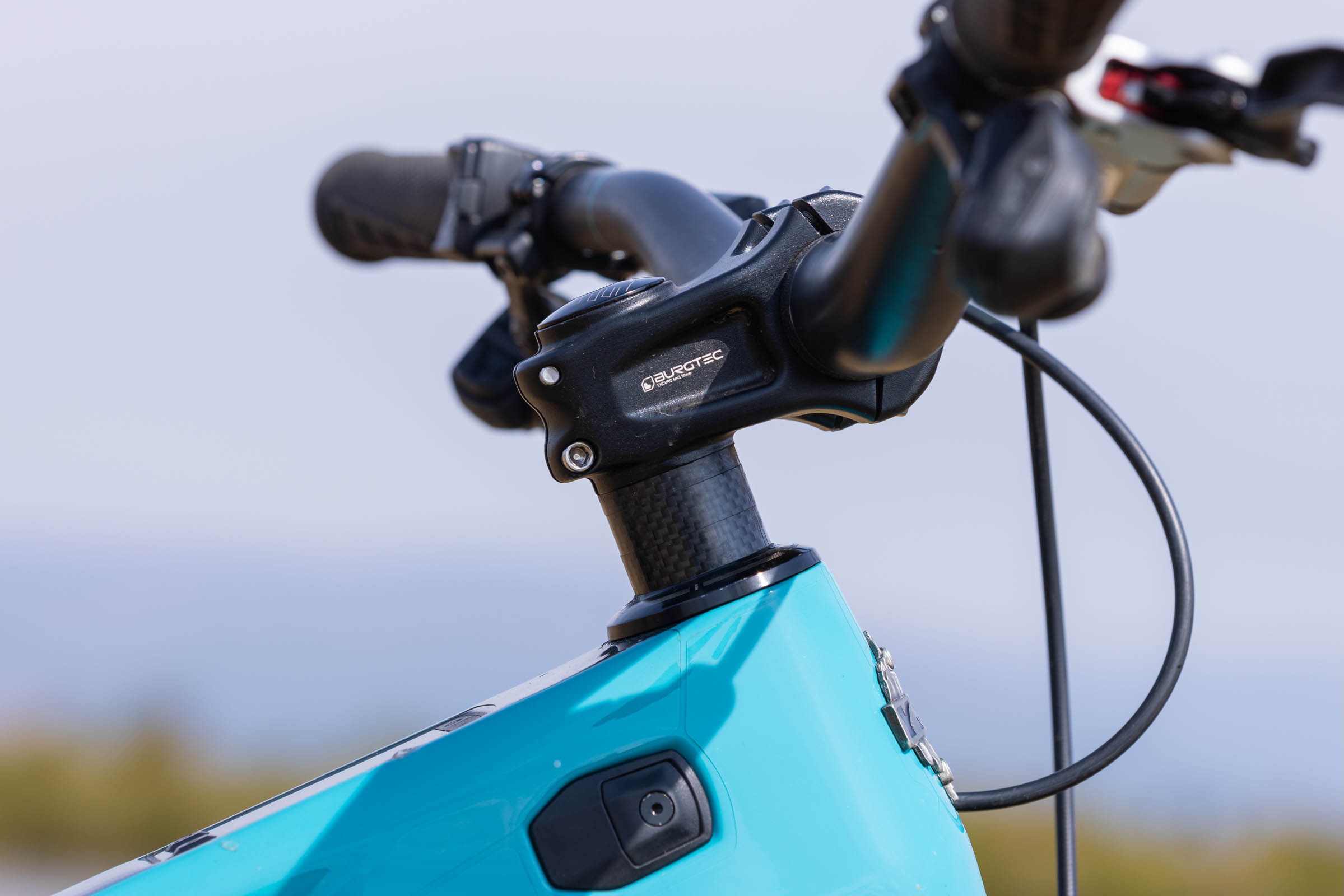 Close-up of the Yeti LTe T4’s Burgtec stem, headset spacers and low front end