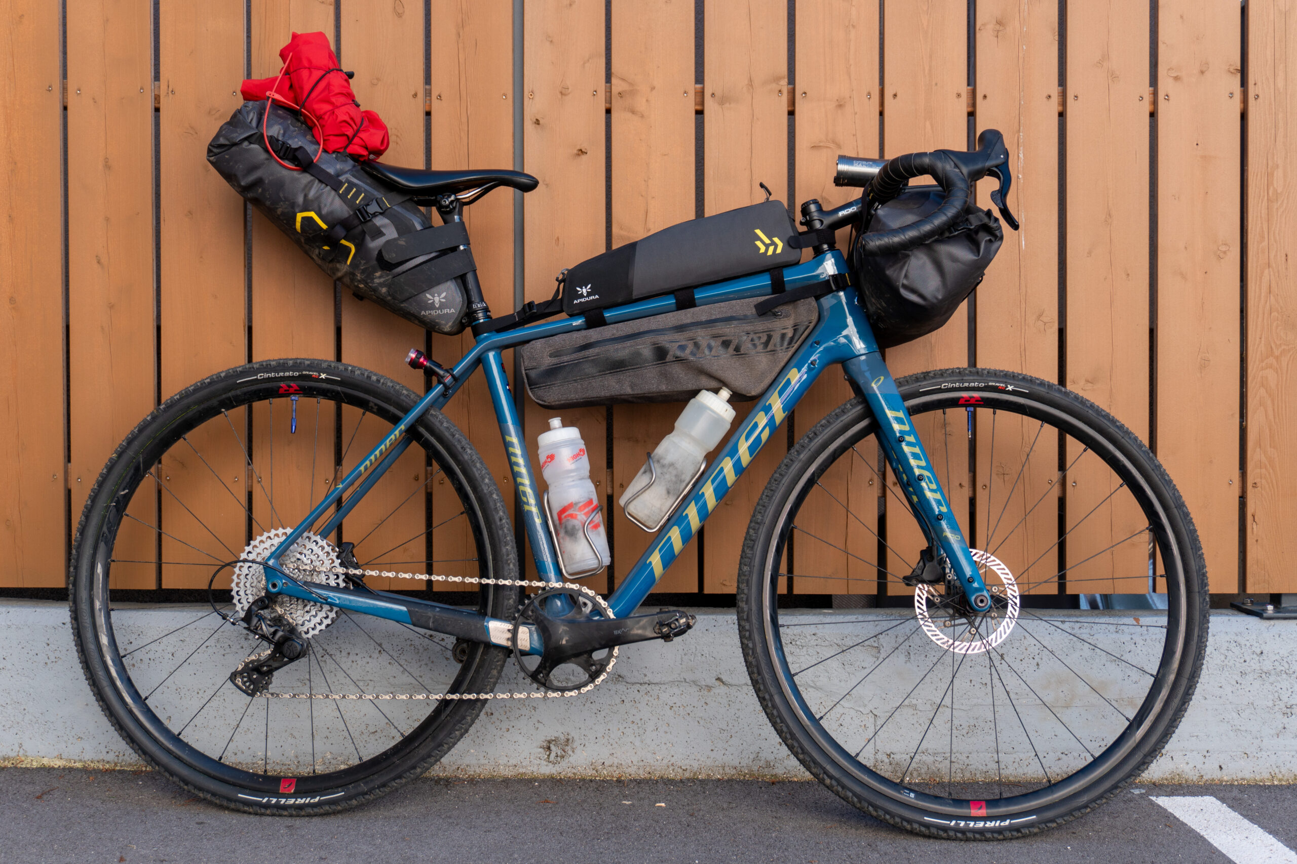 Niner RLT 9 RDO in bikepacking mode against a wall