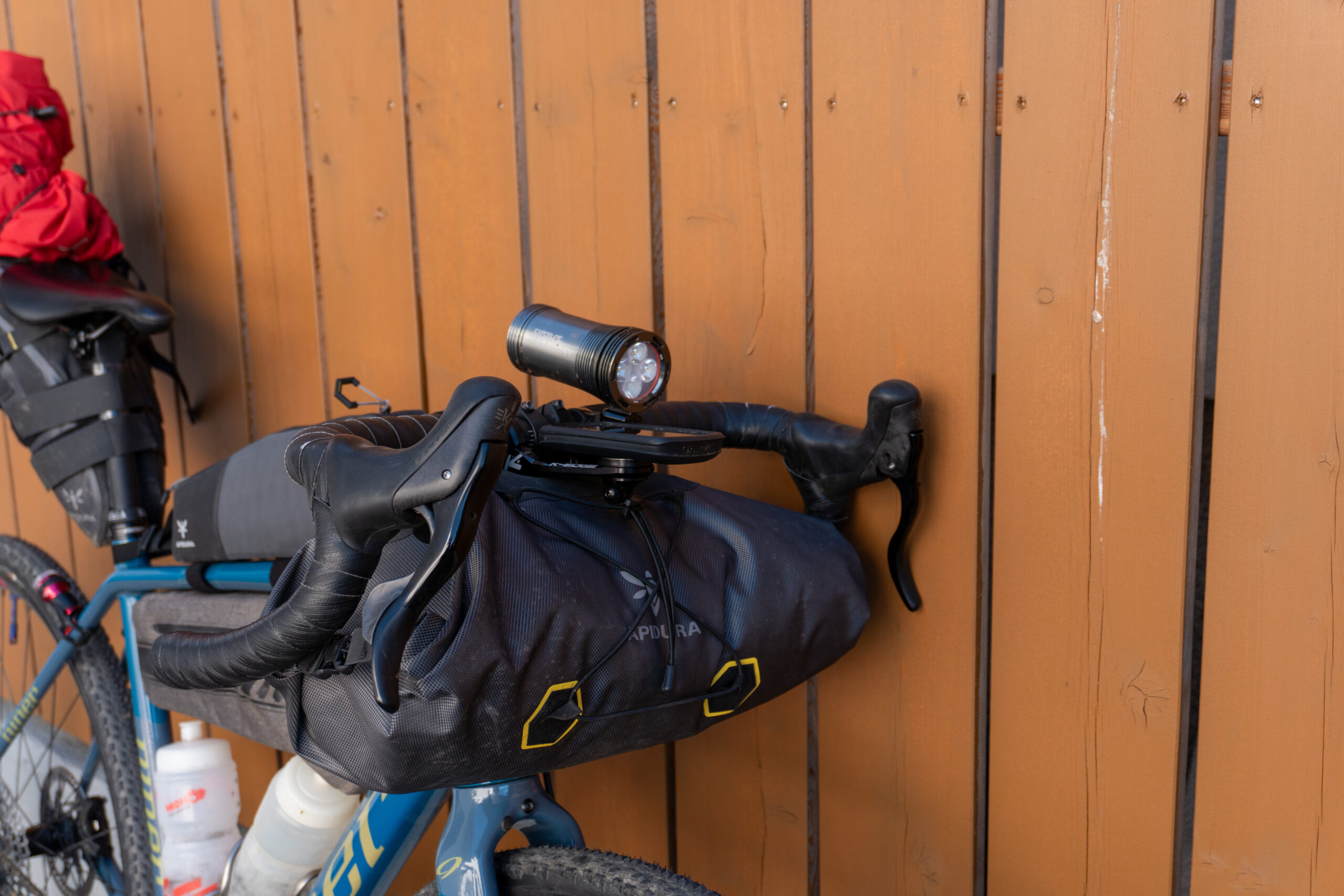Apidura Expedition handlebar pack, Garmin Edge 1040 Solar and Exposure Maxx-D front light 