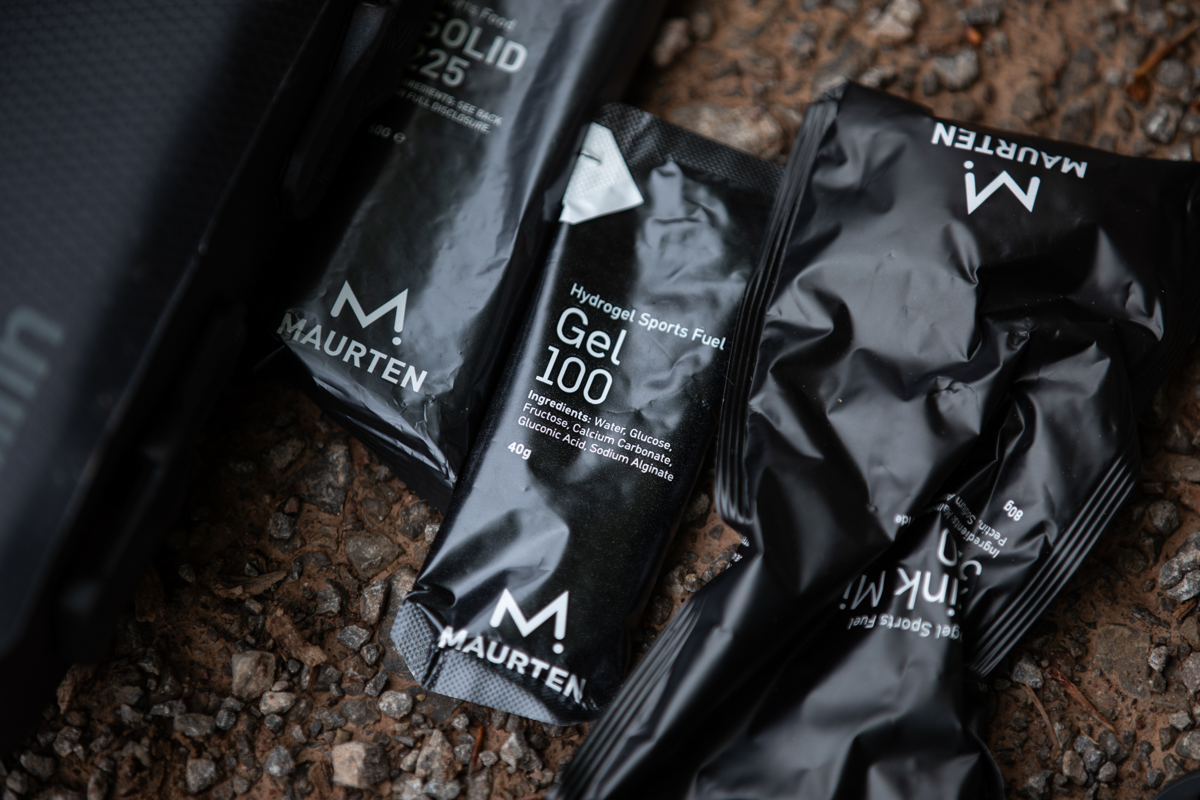 Maurten gels on gravel surface