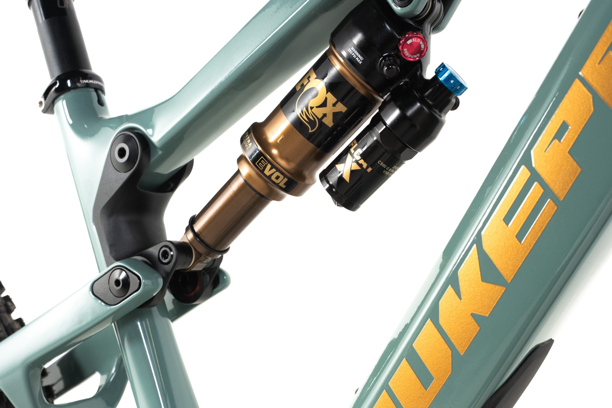 Close-up of the Nukeproof Kilowatt’s Fox Float X Factory shock and single-piece suspension rocker.
