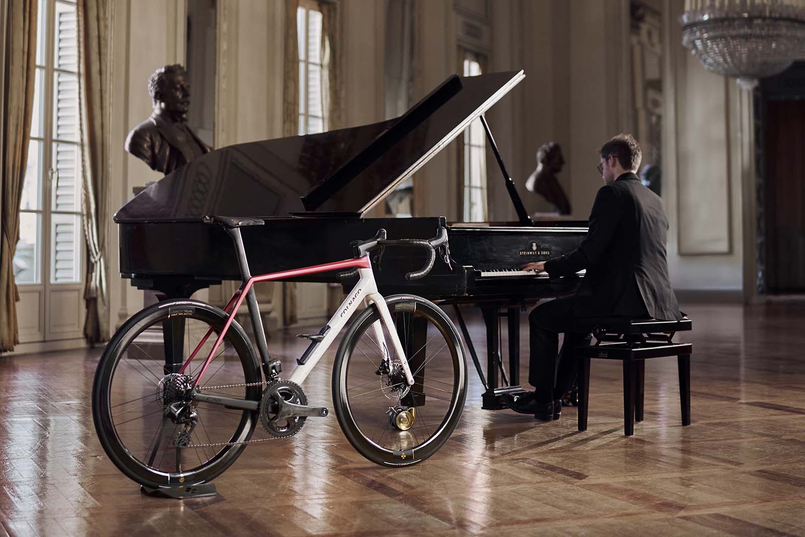 Colnago C72 La Scala road bike next to grand piano.