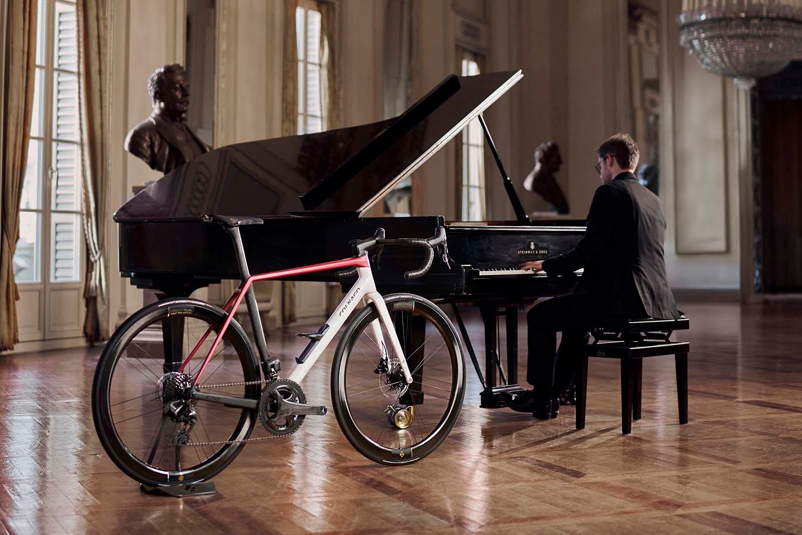 Colnago C72 La Scala road bike next to grand piano.