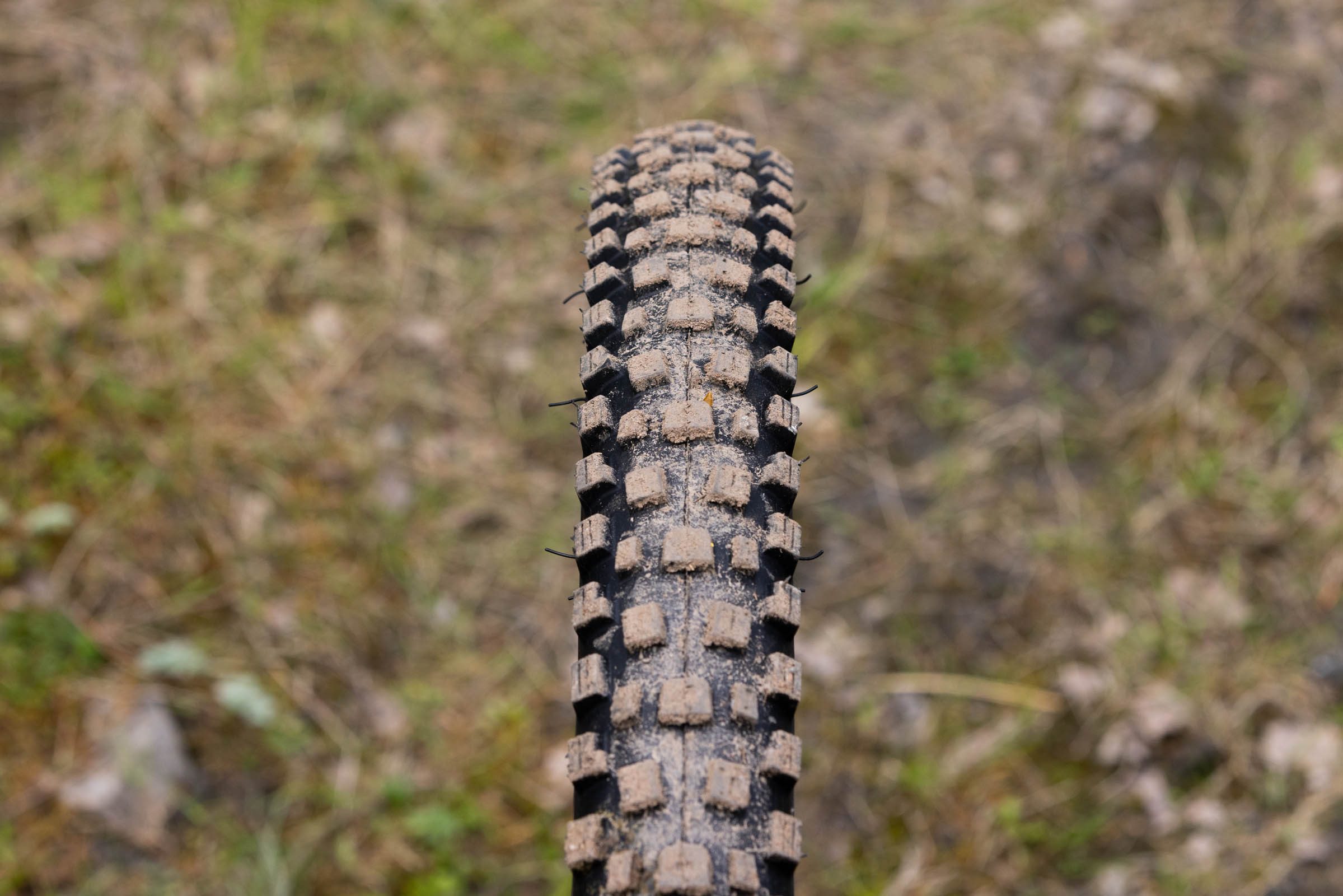 Top-down view of a Nutrak/Vee Attack HPL mountain bike tyre showing its large central tread blocks.
