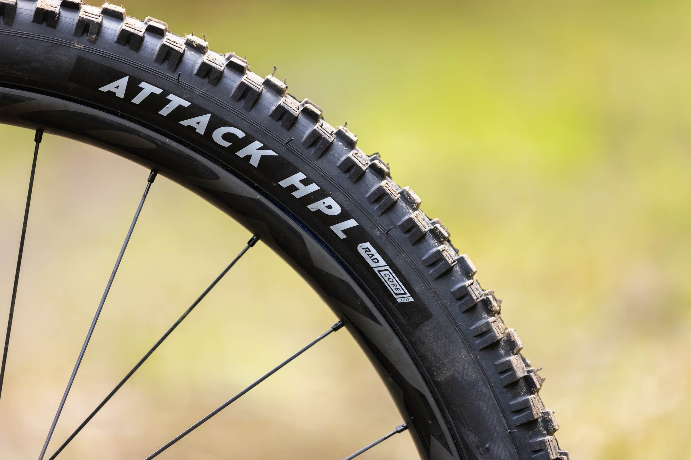 Close-up of a Nutrak/Vee Attack HPL RAD Core mountain bike tyre showing the sidewall branding and tread blocks.