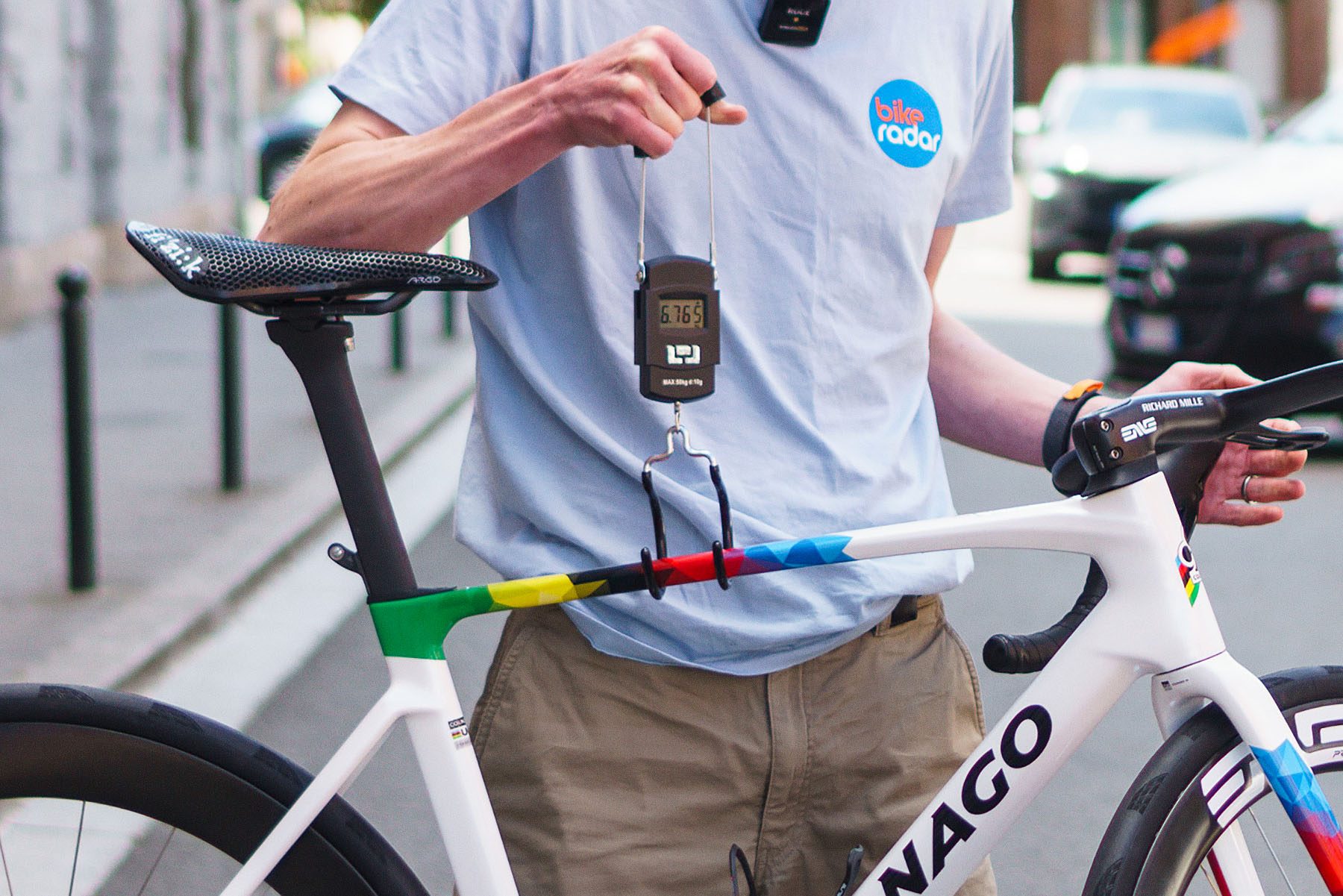 Simon von Bromley weighing Tadej Pogačar's Colnago V5Rs at the 2025 Tour de France