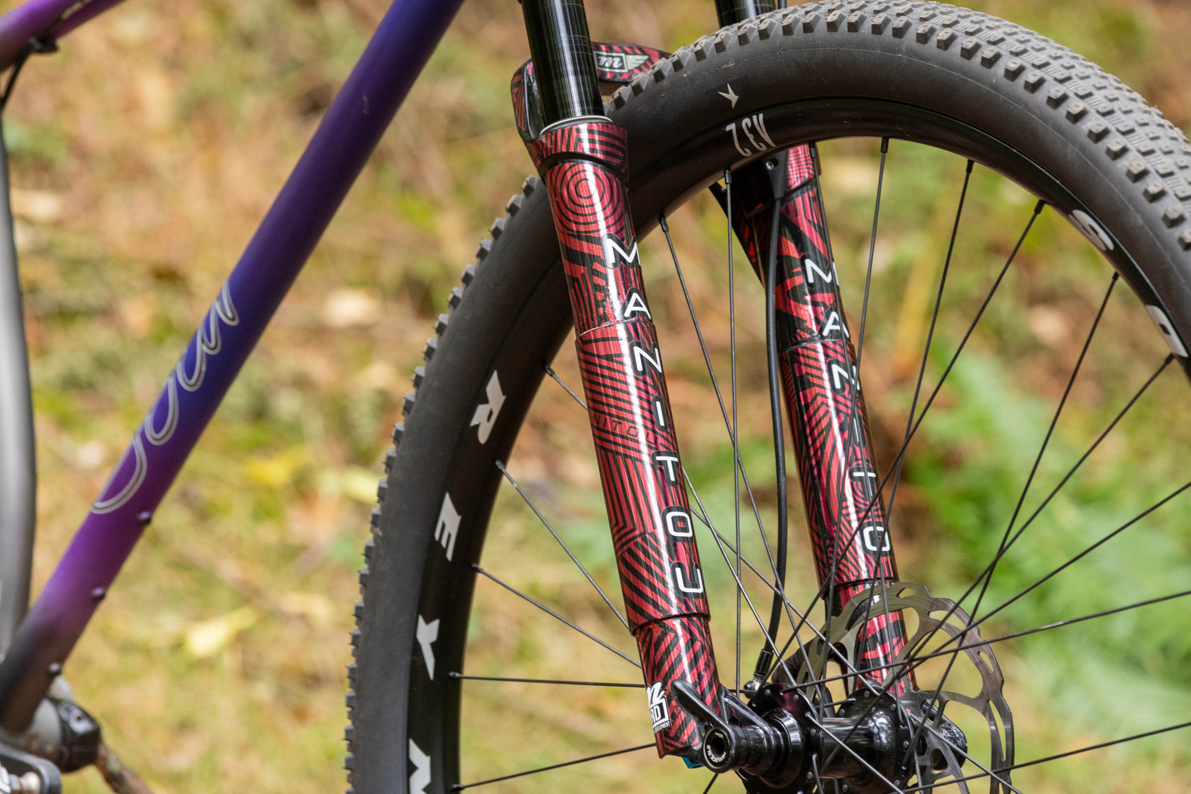 Close-up of the prototype Manitou R8 suspension fork and 32in front wheel on the Sour Cycles Pasta Party 32.
