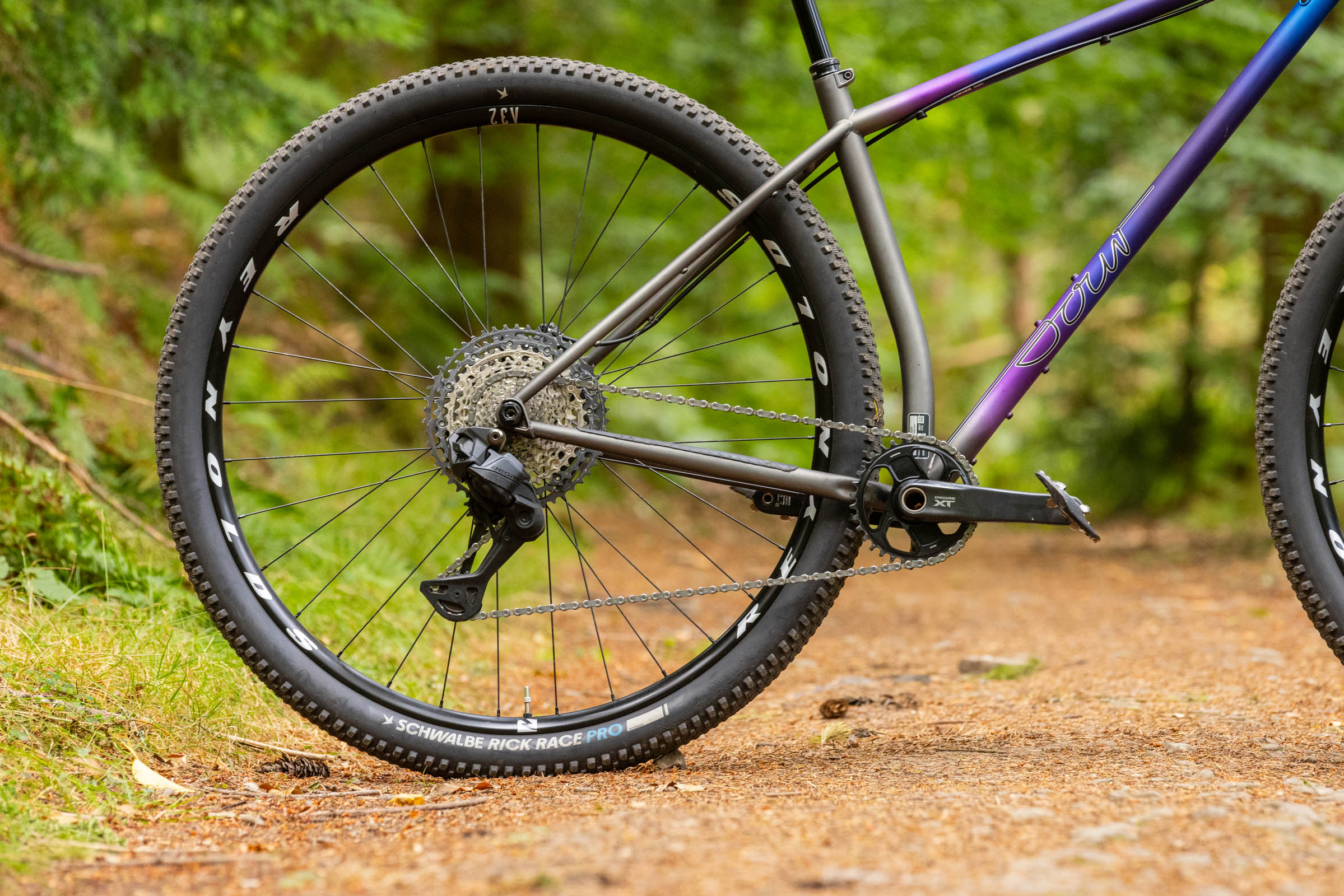 Close-up of the rear half of the Sour Cycles Pasta Party 32, showing its 32in rear wheel, drivetrain and long chainstays.