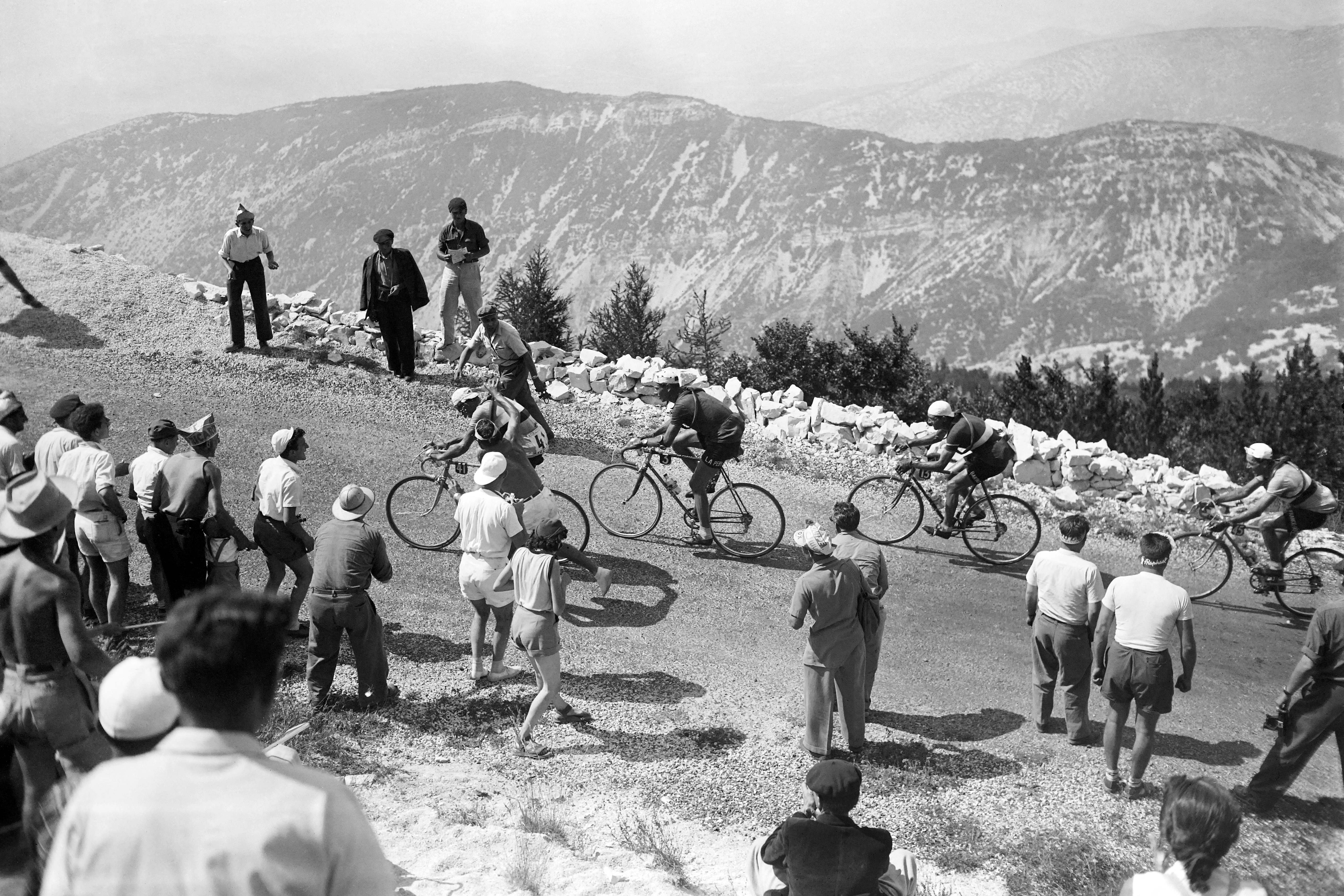 French cyclist Raphaël Geminiani followed by the Swiss Hugo Koblet and the Italian Gino Bartali are in action on a mountain road in the Ventoux during the 17th stage of the Tour de France 1951 between Montpellier and Avignon, on July 22, 1951. (Photo by - / AFP) (Photo by -/AFP via Getty Images)