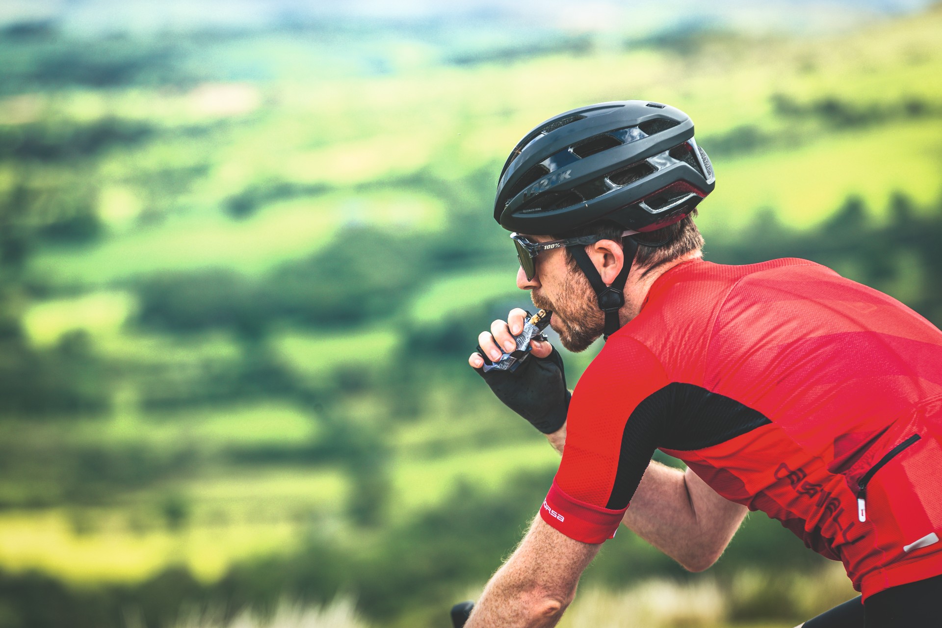 Cyclist eating an energy bar
