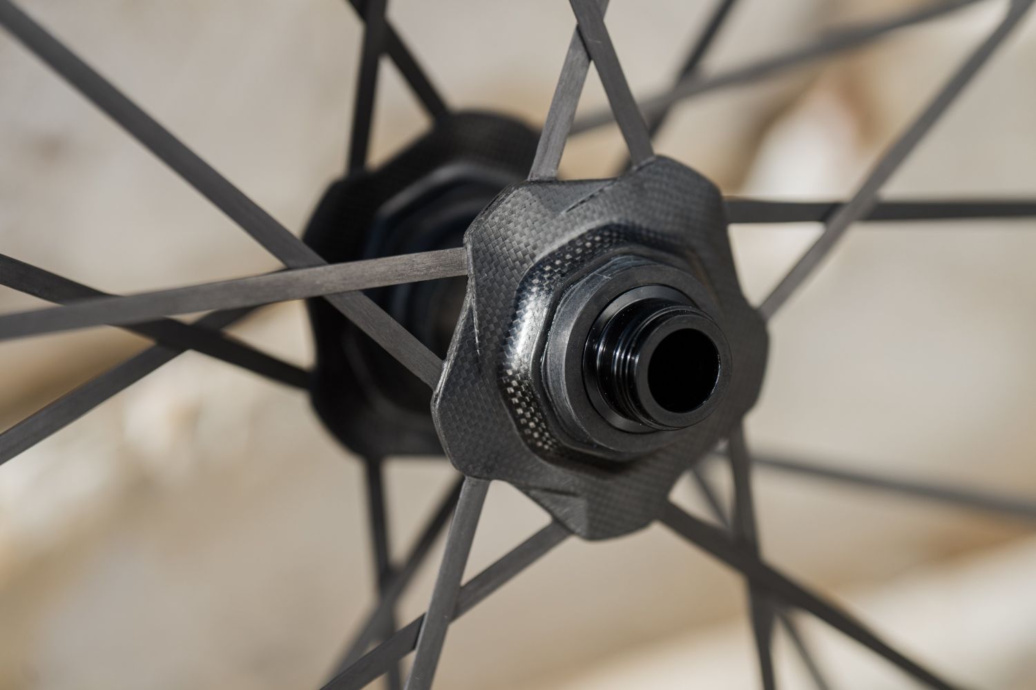 Close up of the Cadex Max XC carbon hub with carbon spokes bonded into the hub flanges.