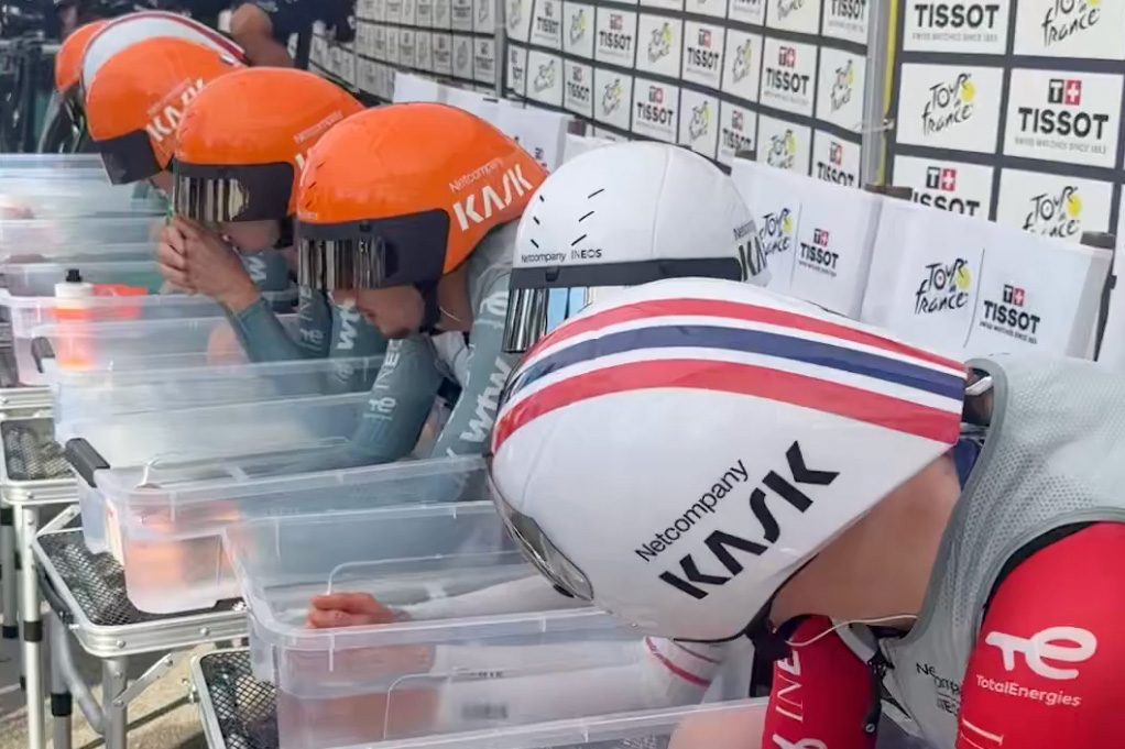 Netcompany-Ineos with arms in water tubs.