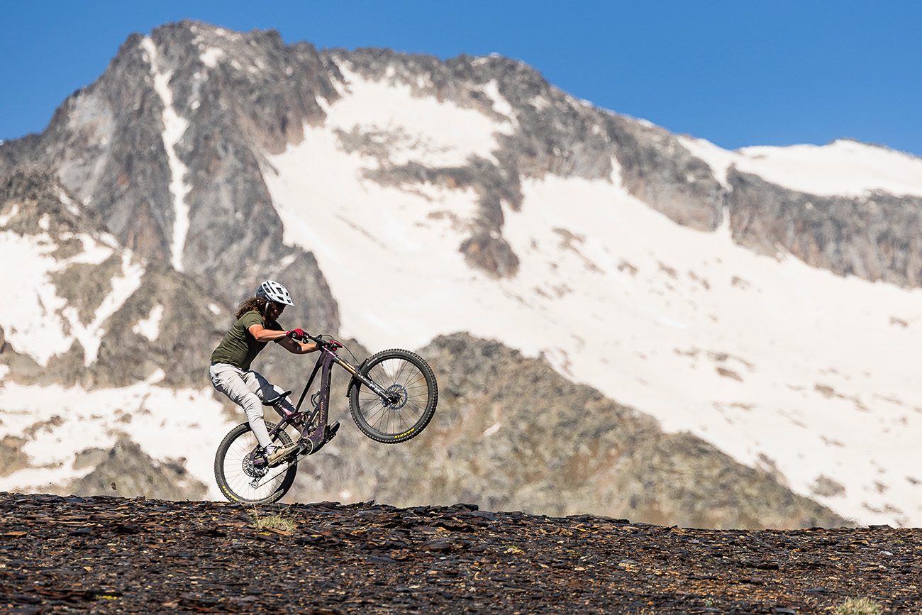 Orbea Wild LT M-LTD RS being manualled with mountains in the background