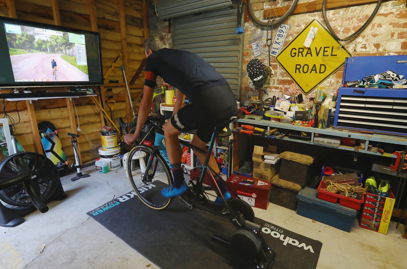 Cycling indoors in a garage on a smart trainer and Zwift