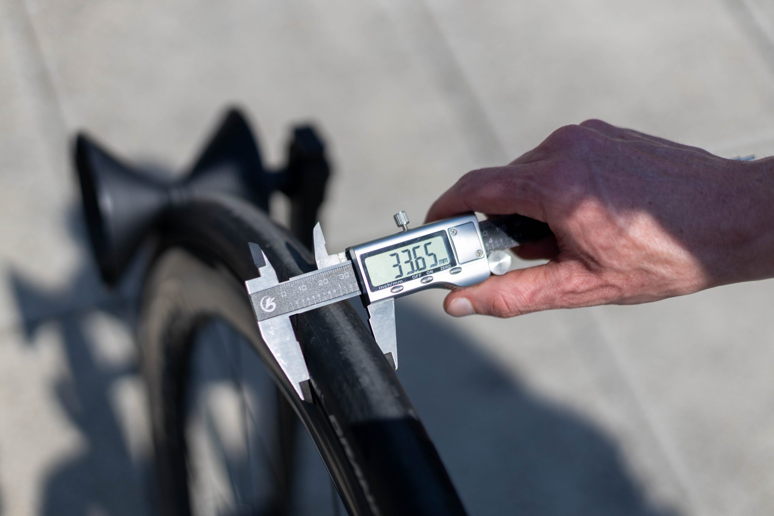 Calipers showing tyre width of 33.65mm.