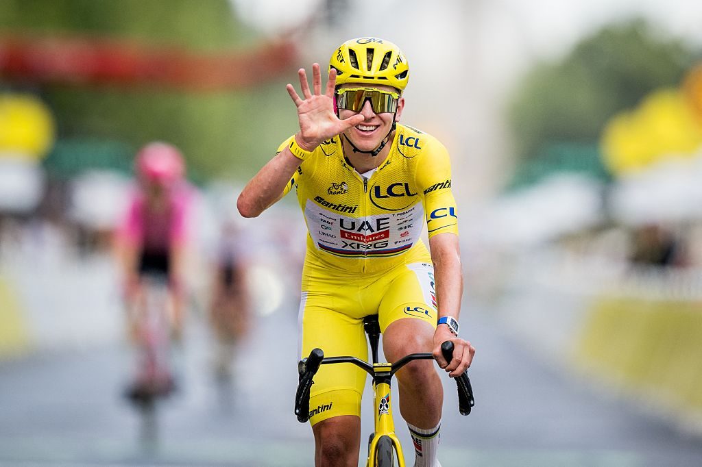 Slovenian Tadej Pogacar of UAE Team Emirates-XRG celebrates as he crosses the finish line at stage 21 of the 2026 Tour de France cycling race, a stage of 130km from Thoiry to Paris Champs-Elysees , on Sunday 26 July 2026. The 113th edition of the Tour de France starts on Saturday 4 July in Barcelona, Spain, and will finish in Paris, France on the 26th of July. BELGA PHOTO JASPER JACOBS (Photo by JASPER JACOBS / BELGA MAG / Belga / AFP via Getty Images)