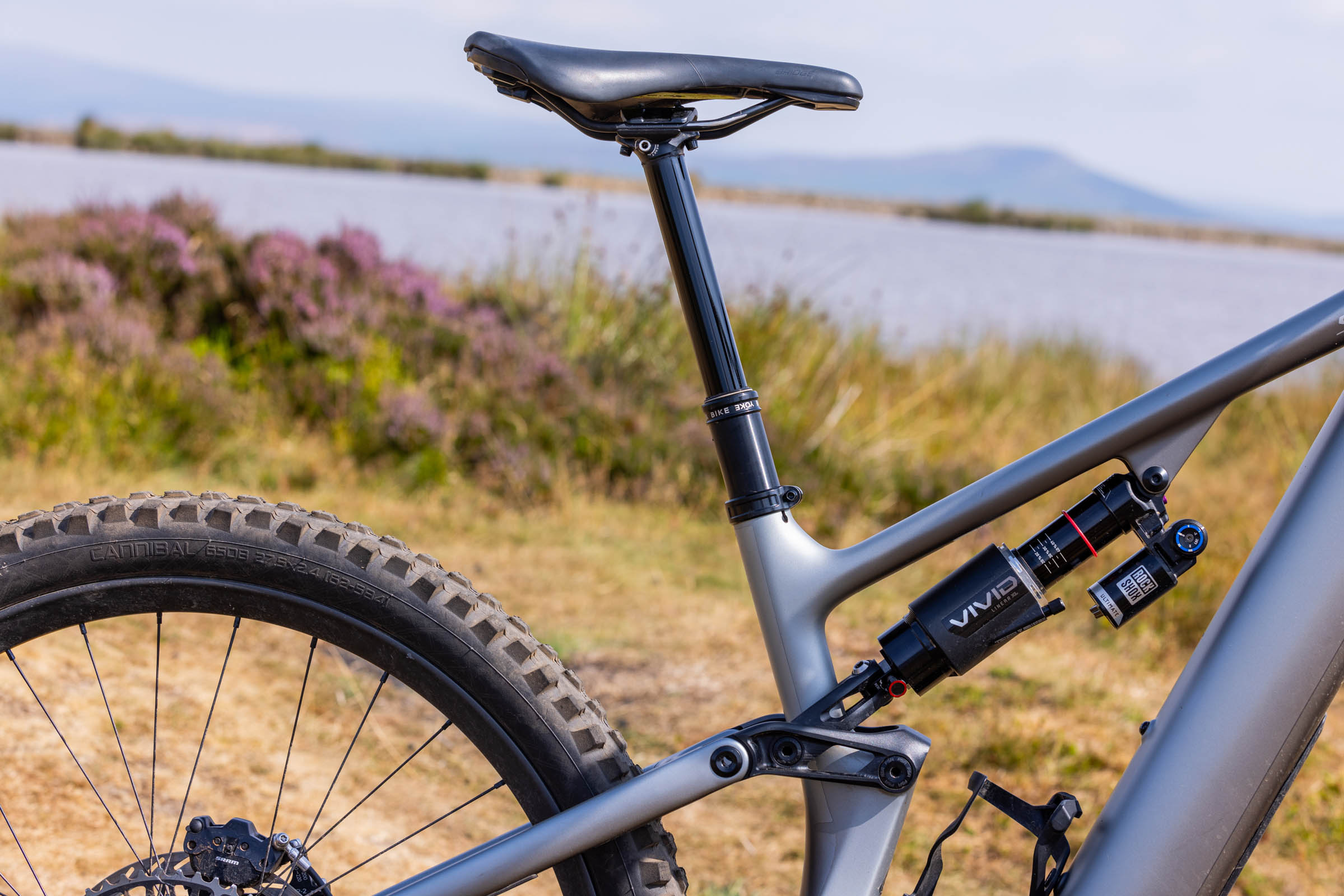 Close-up of the Specialized Levo 4 EVO Pro seat tube, BikeYoke dropper post and RockShox Vivid rear shock