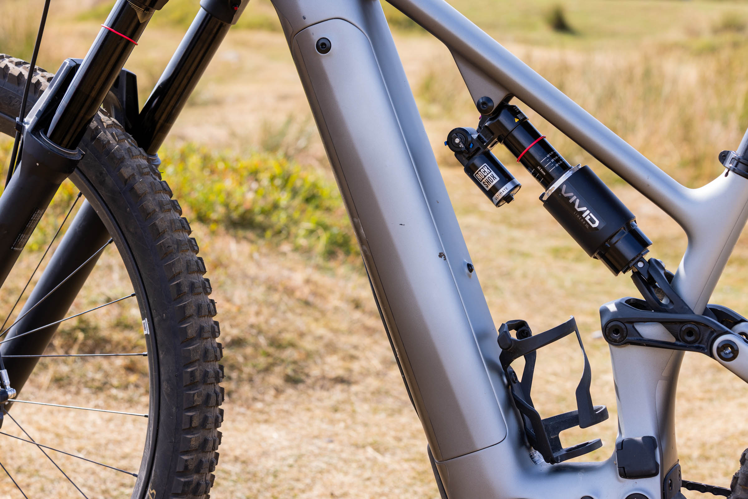 Close-up of the Specialized Levo 4 EVO Pro down tube, battery compartment and RockShox Vivid Ultimate shock