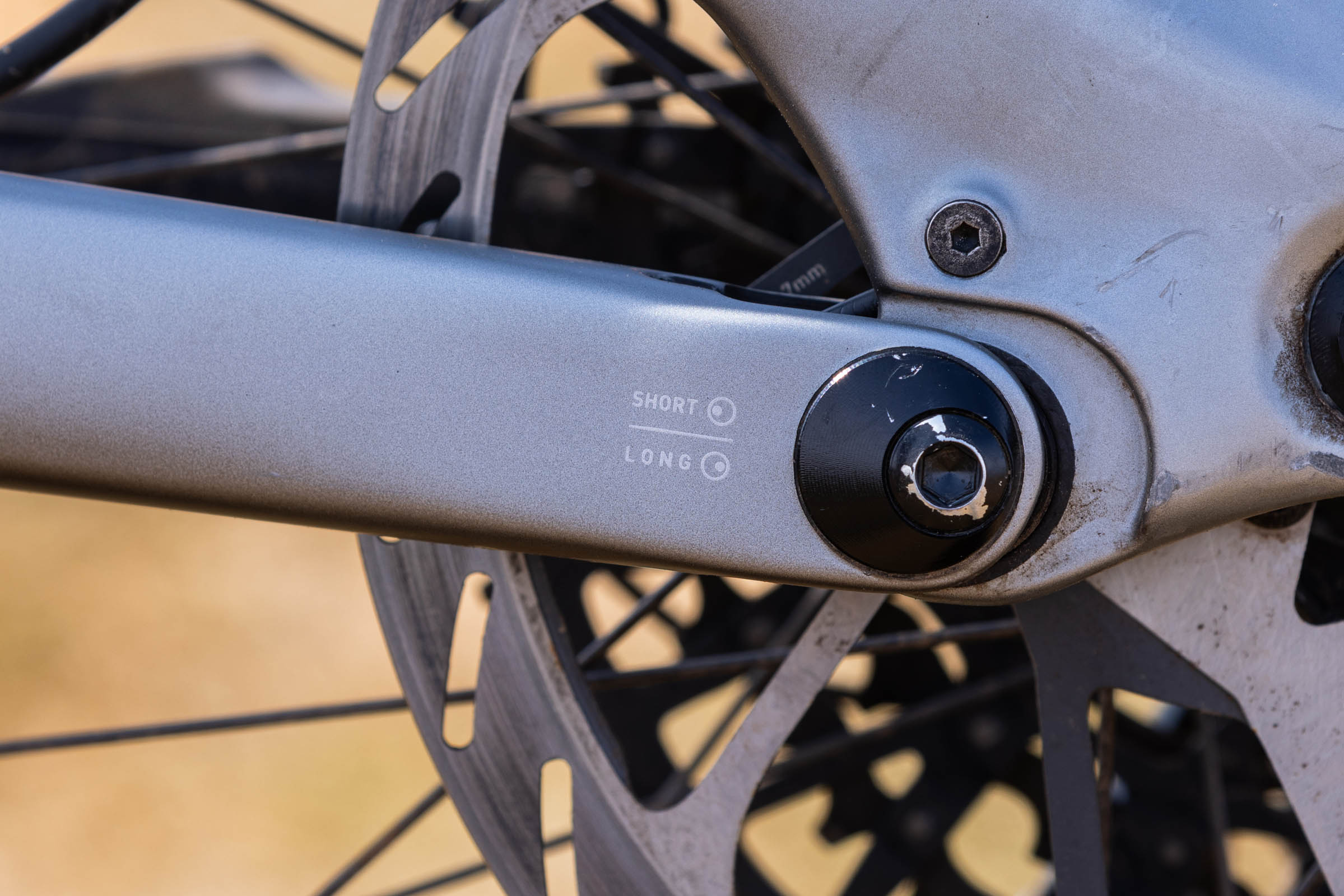 Close-up of the Specialized Levo 4 EVO Pro rear dropout showing the short and long chainstay adjustment positions