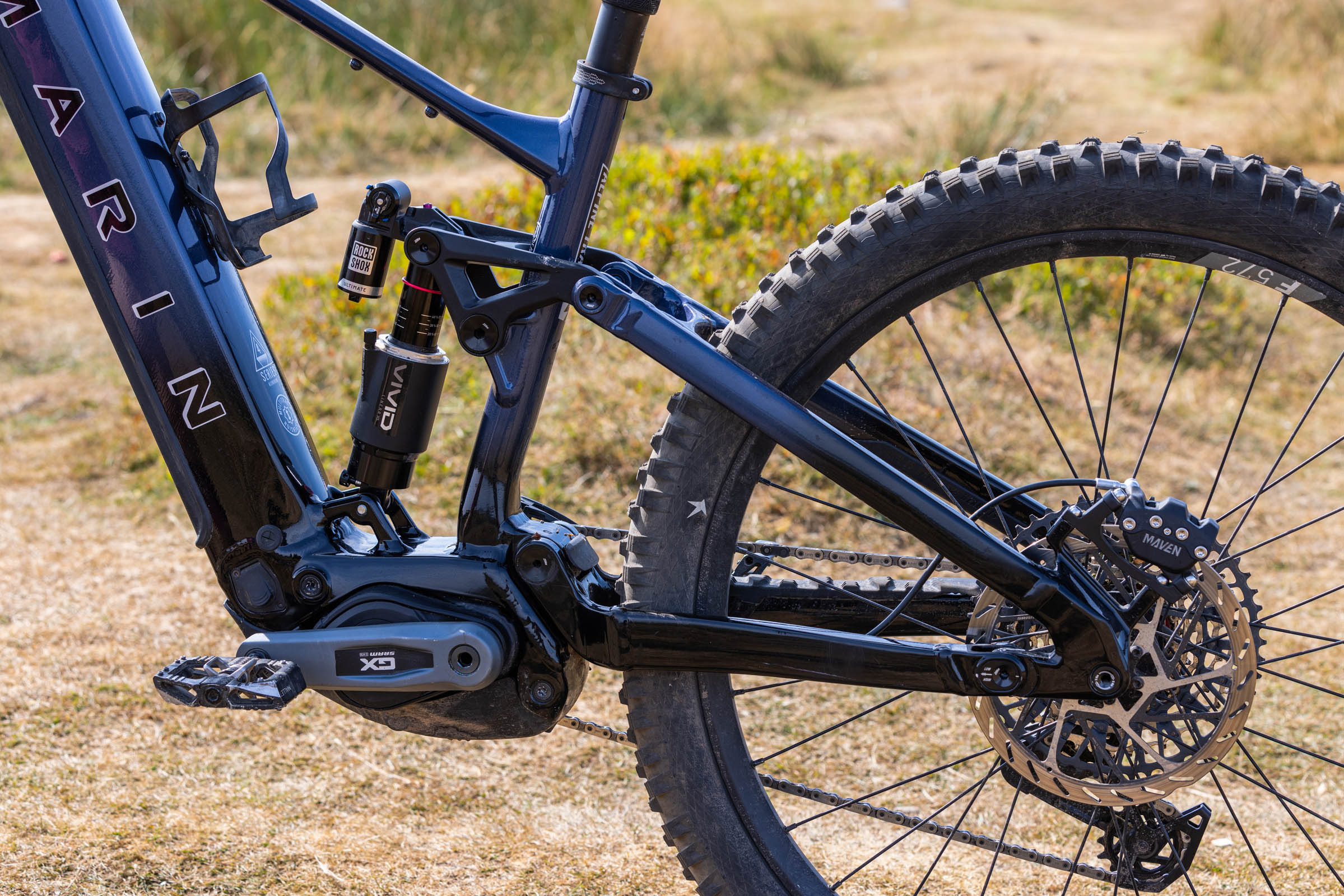 Close-up of the Marin Alpine Trail E XR’s aluminium frame, four-bar Horst-link suspension and rear wheel