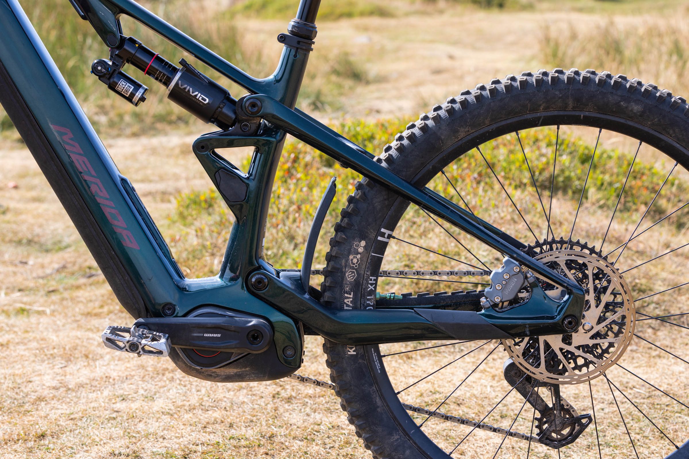 Close-up of the Merida Lithos 8000’s flexstay rear suspension, RockShox Vivid shock and rear wheel