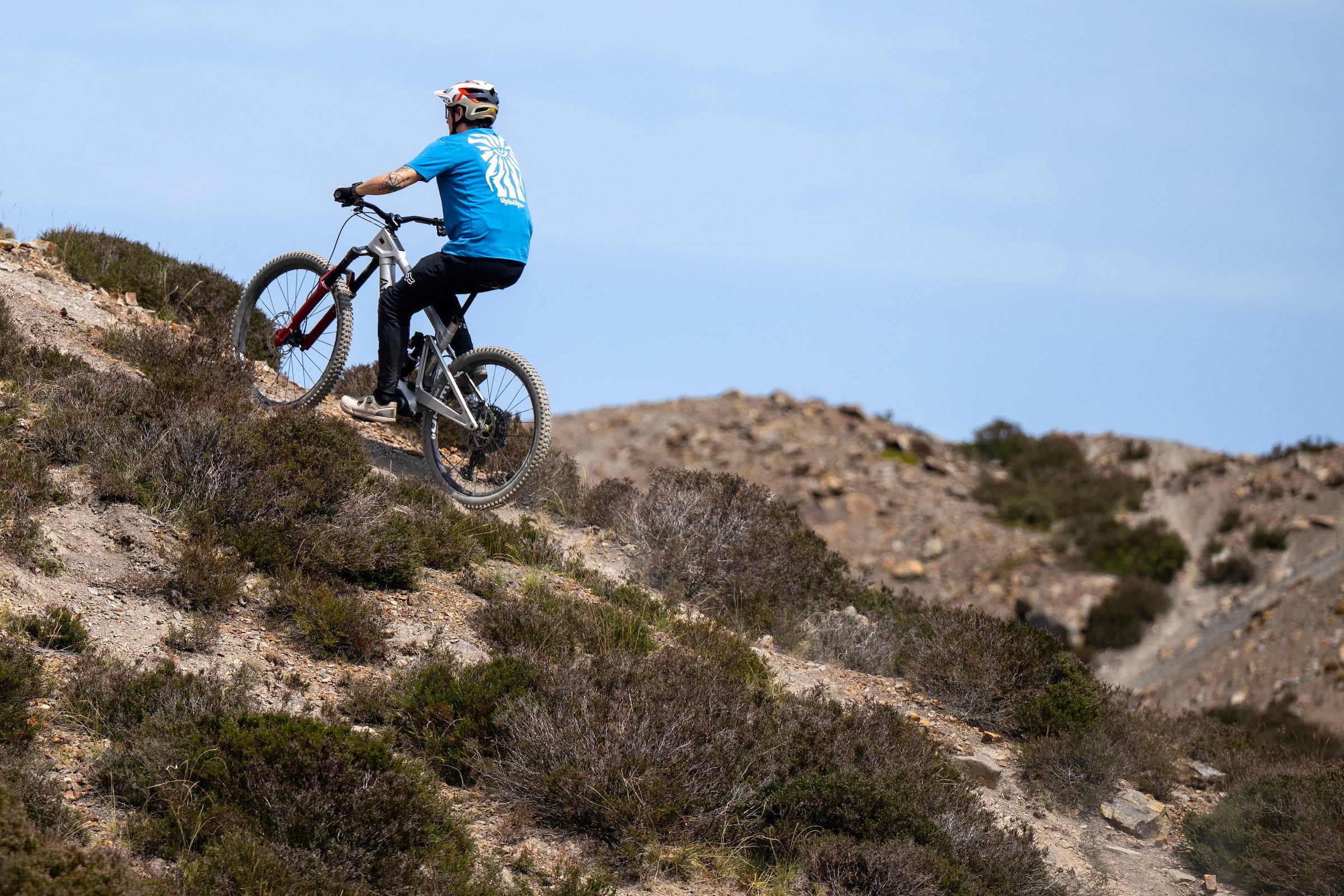Rider climbs a steep, loose and rocky hillside on the silver Atherton S.170E.2 eMTB