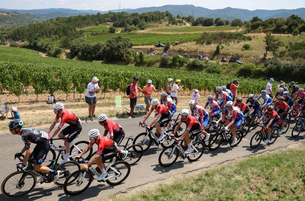 CYCLING-FRA-TDF2022-STAGE16 The pack of riders cycles during the 16th stage of the 109th edition of the Tour de France cycling race, 178,5 km between Carcassonne and Foix in southern France, on July 19, 2022. (Photo by Thomas SAMSON / AFP) (Photo by THOMAS SAMSON/AFP via Getty Images)