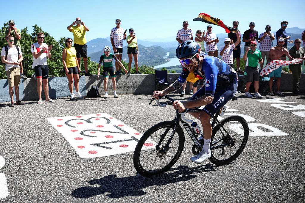 Groupama - FDJ's French rider Quentin Pacher cycles in the final ascent of Col du Grand Colombier in the final kilometeres of the 13th stage of the 110th edition of the Tour de France cycling race, 138 km between Chatillon-sur-Chalaronne in central-eastern France and Grand Colombier, in the Jura mountains in Eastern France, on July 14, 2023. (Photo by Anne-Christine POUJOULAT / AFP)