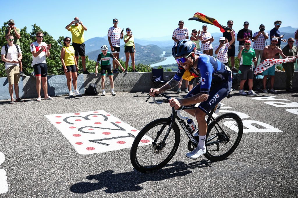 Groupama - FDJ's French rider Quentin Pacher cycles in the final ascent of Col du Grand Colombier in the final kilometeres of the 13th stage of the 110th edition of the Tour de France cycling race, 138 km between Chatillon-sur-Chalaronne in central-eastern France and Grand Colombier, in the Jura mountains in Eastern France, on July 14, 2023. (Photo by Anne-Christine POUJOULAT / AFP)