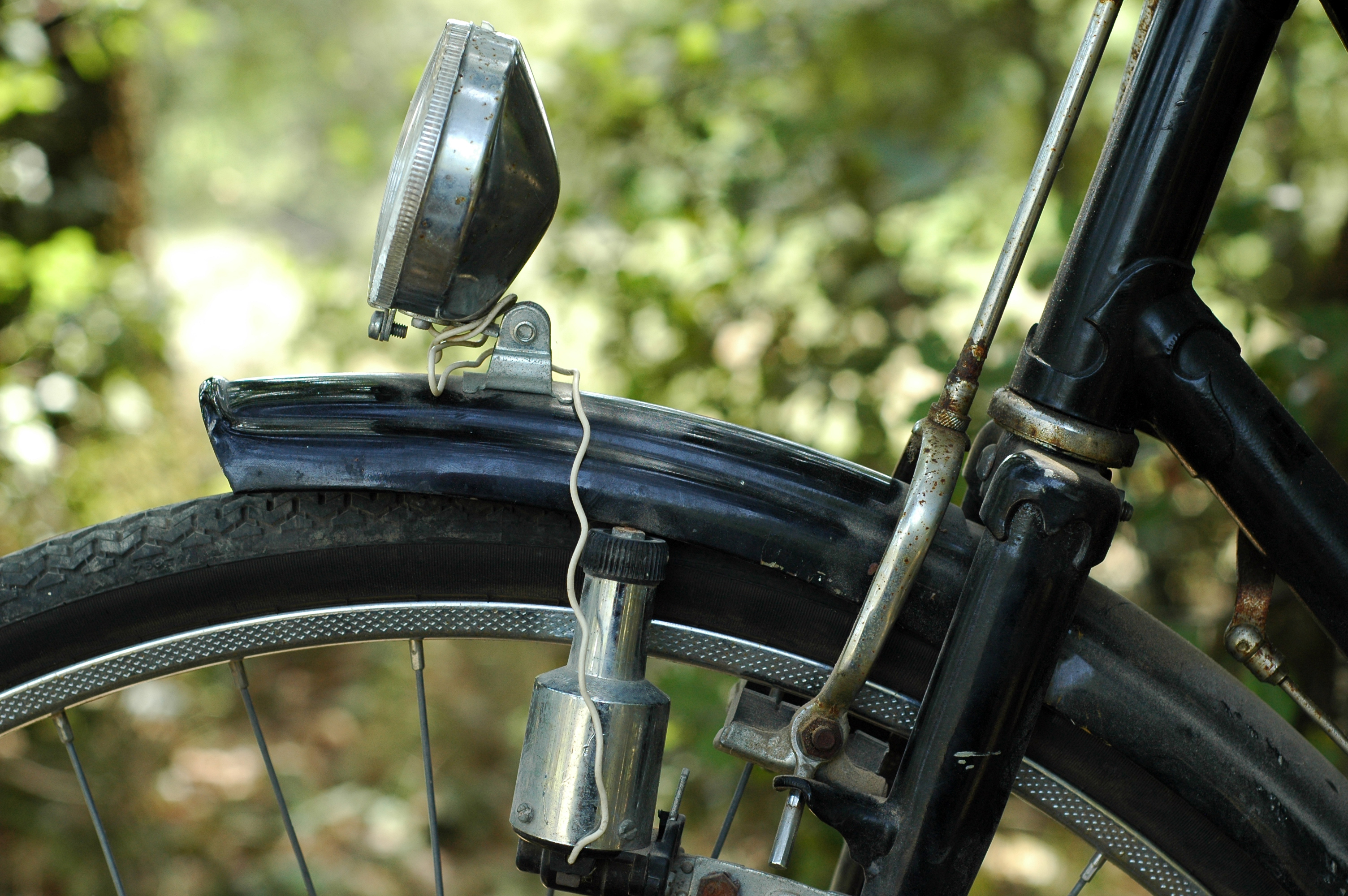 Close up of a headlamp and a dynamo. Too, a concept for ecology, rural life and life outdoors. Close up of a headlamp and a dynamo. Too, a concept for ecology, rural life and life outdoors.