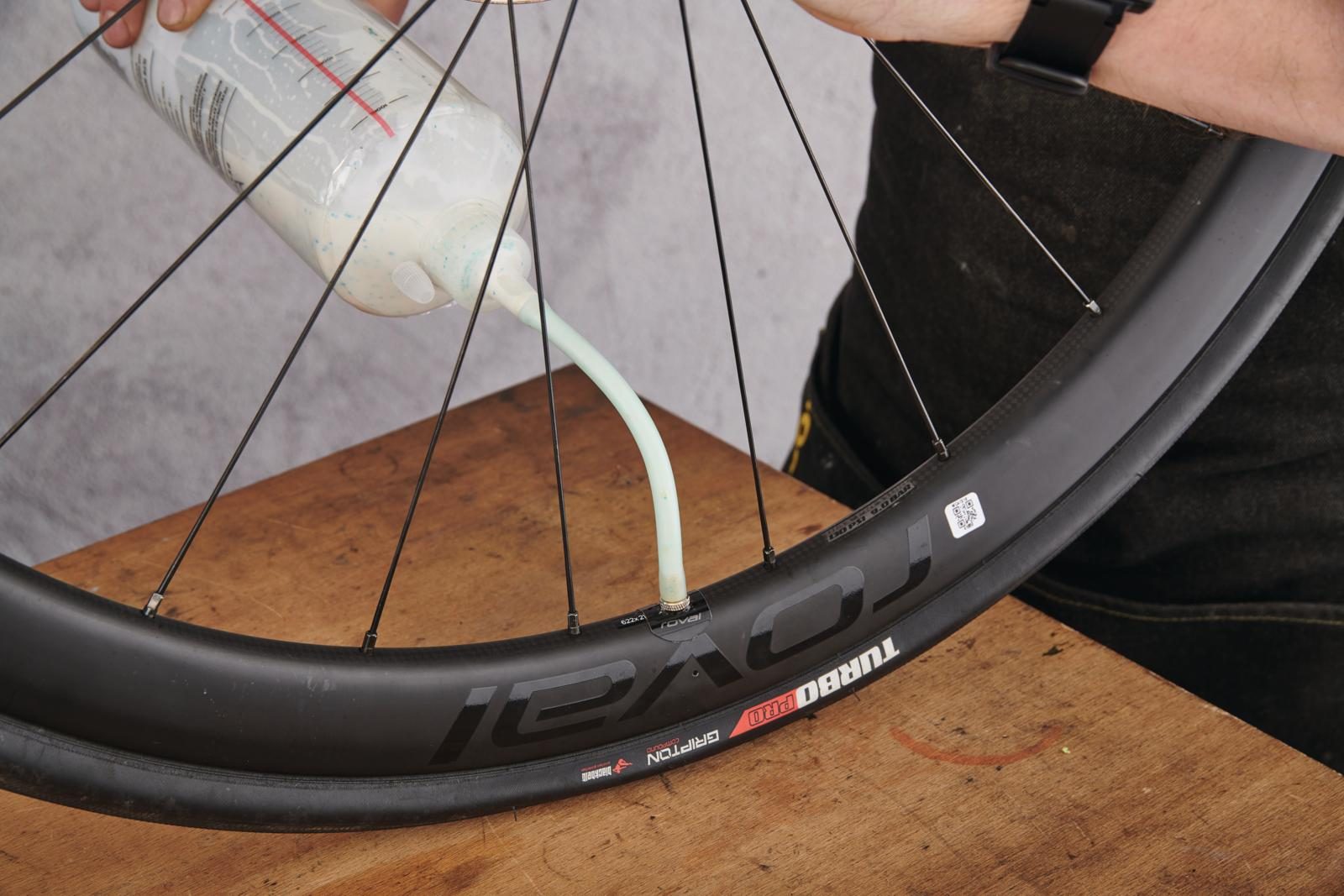 Adding sealant to a tubeless tyre Adding sealant to a tubeless tyre